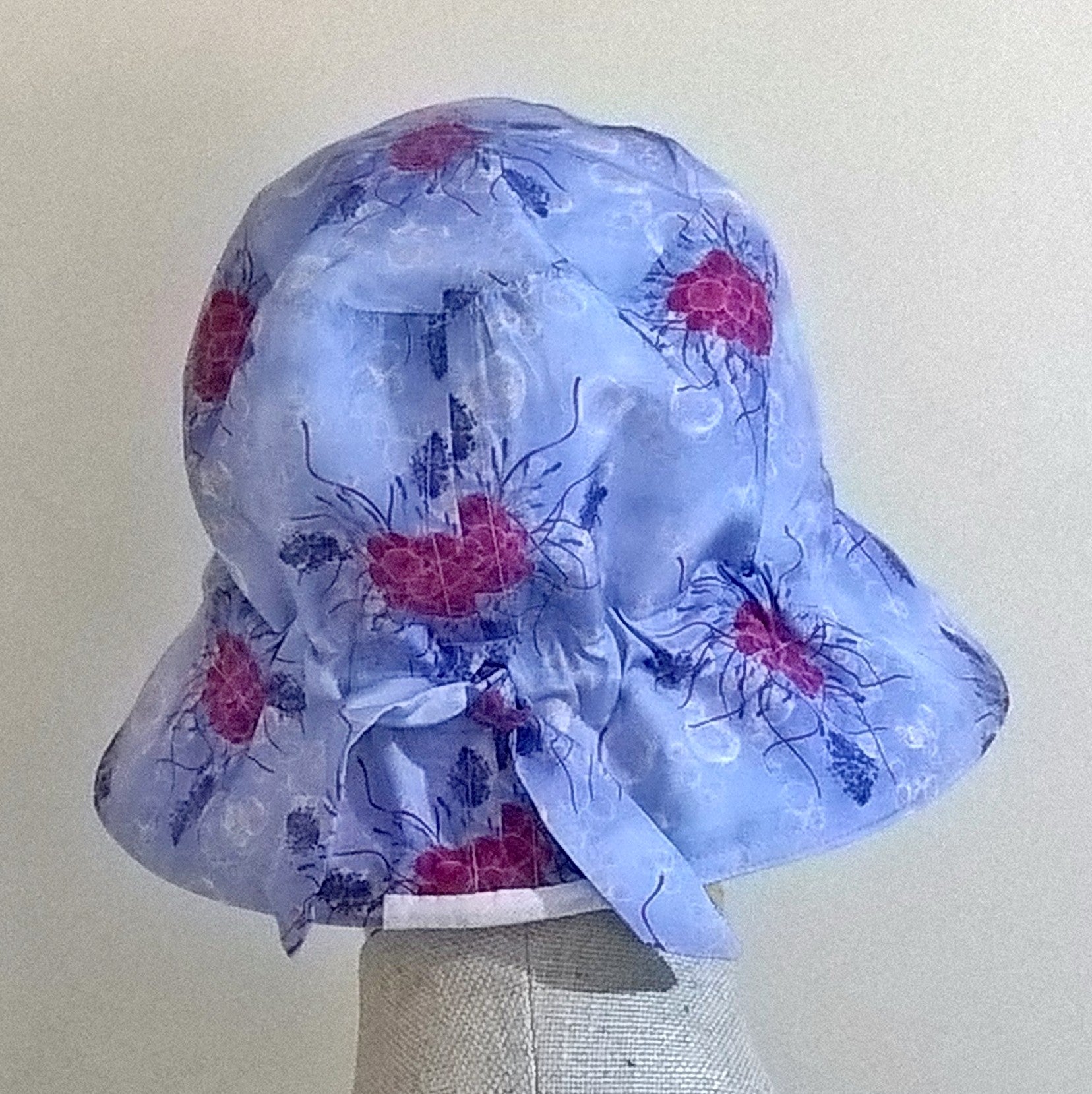 Adjustable tie detail at back of cotton silk bucket hat