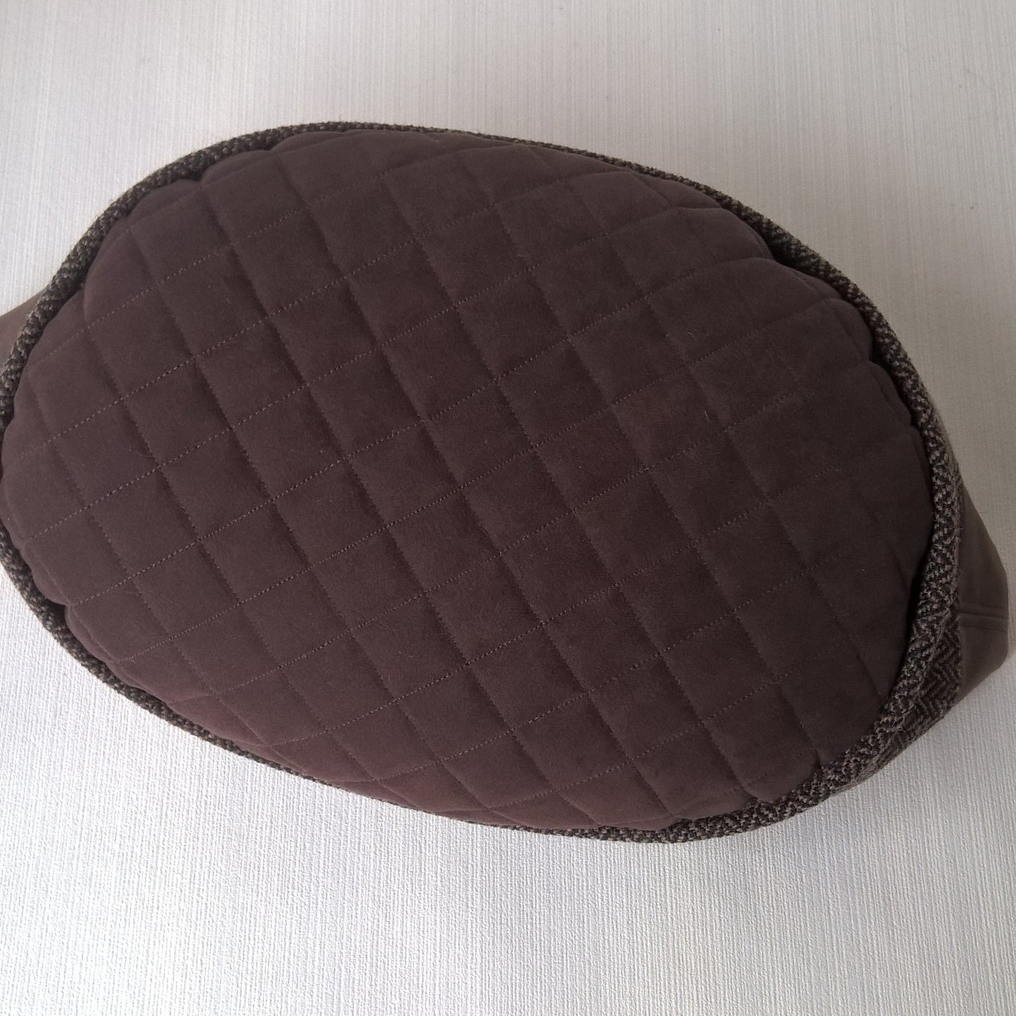 Quilted tip of brown herringbone wool hat
