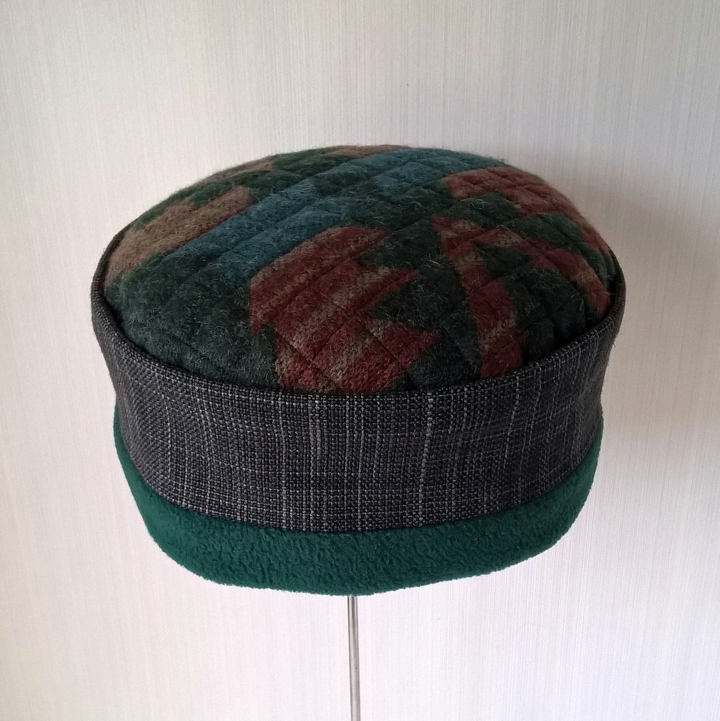 Brimless cap in Aztec design with forest green fleece lining