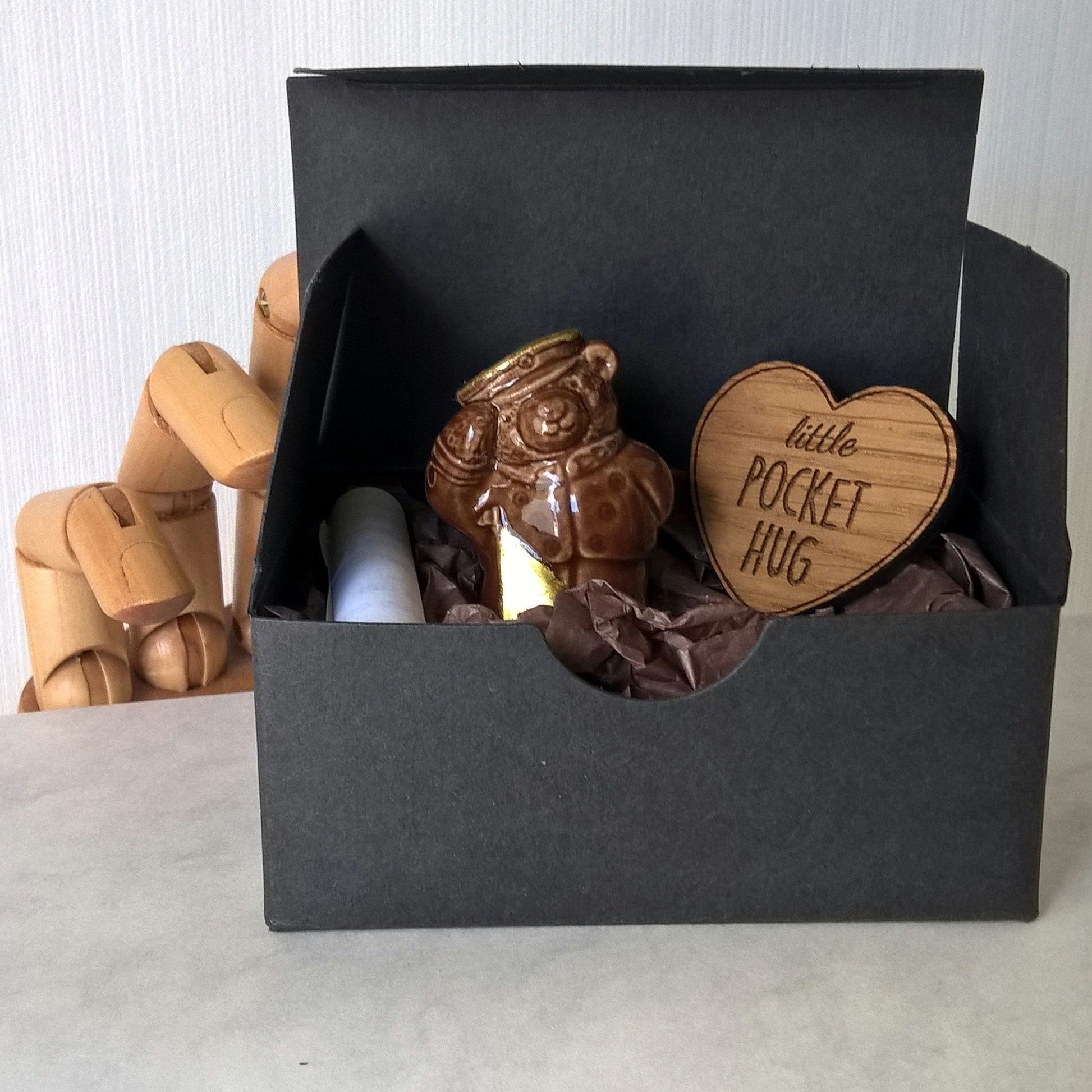 The miniature vintage bear and engraved heart are boxed ready for gifting