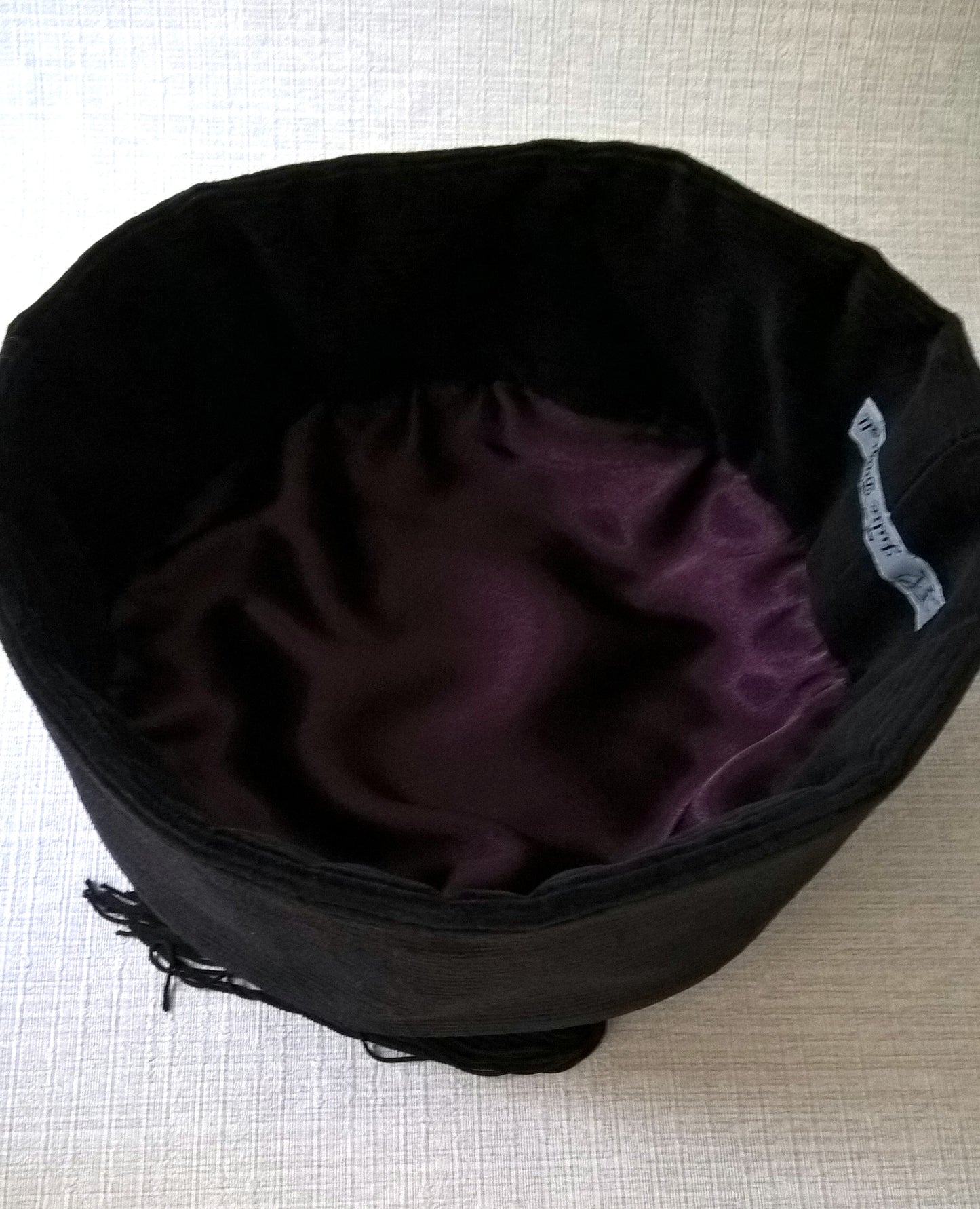The interior of the smoking cap is hand-finished with a satin lining