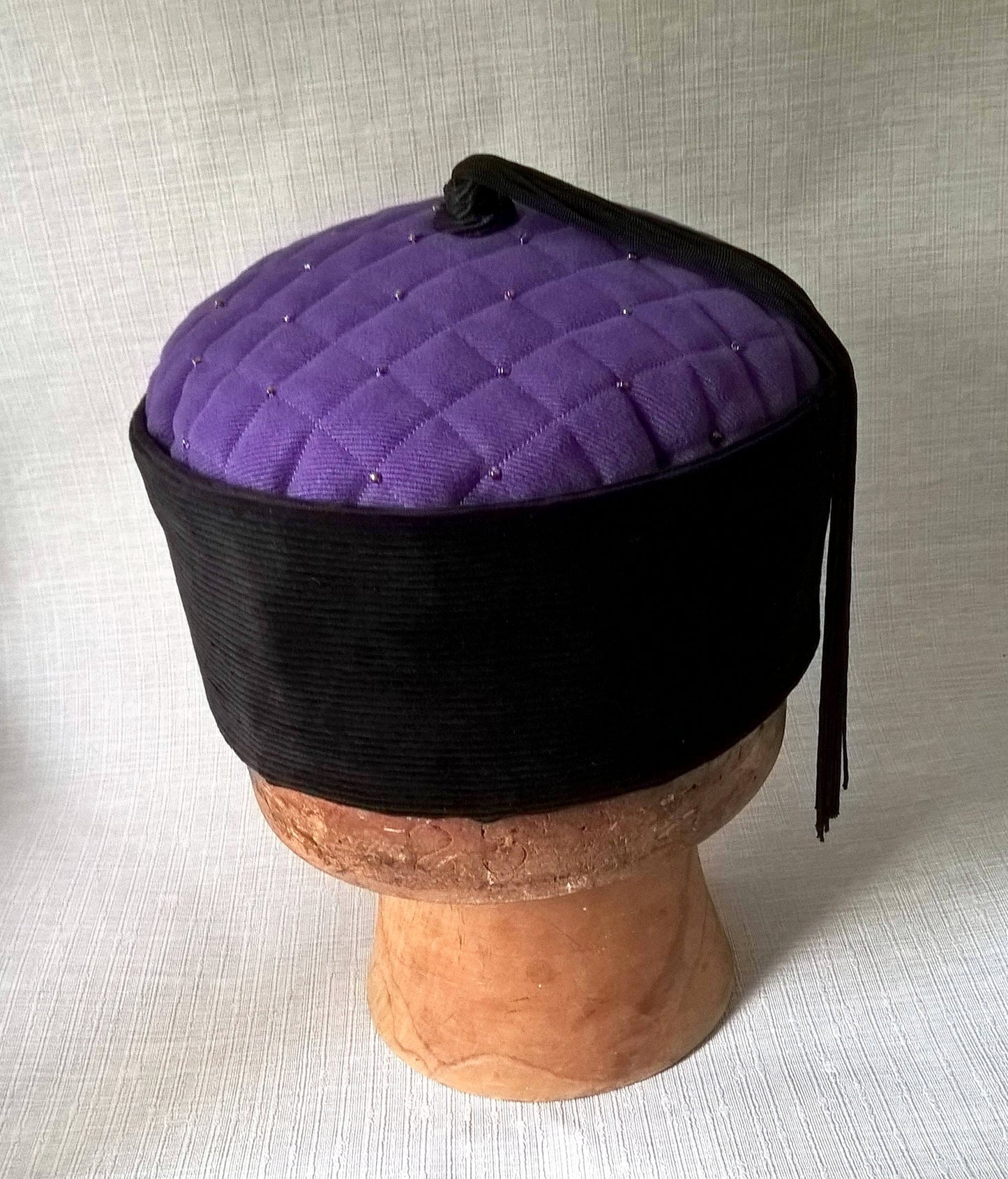 Smoking cap with purple twill tip, black corduroy crown and tassel