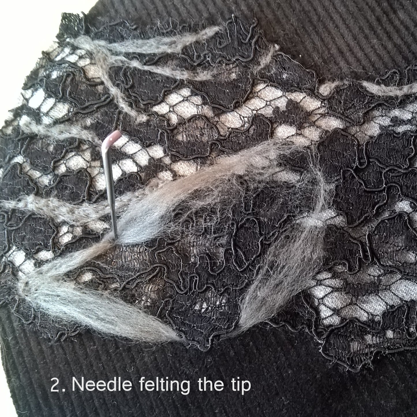 The creative process - needle felting the fabrics together for the smoking hat tip