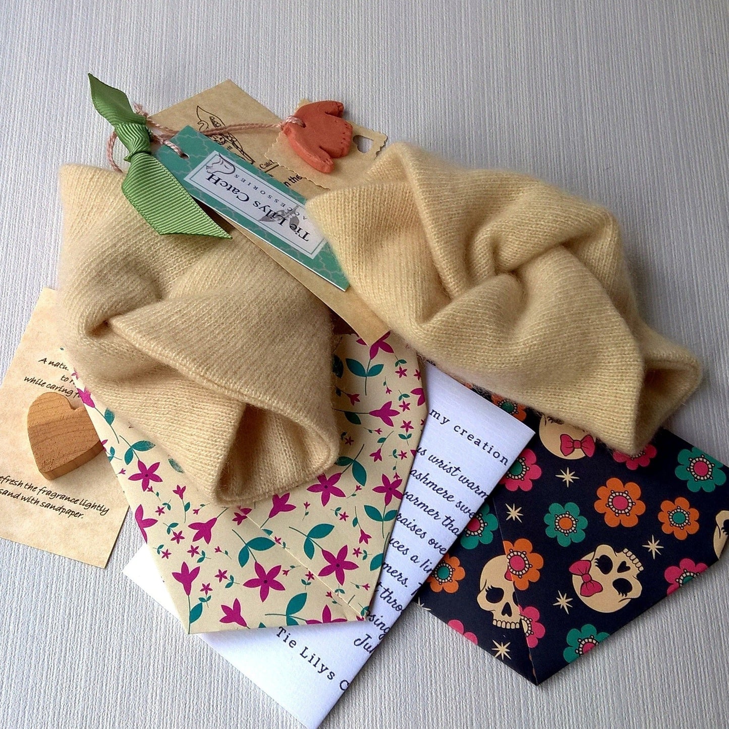 Cream 100% cashmere wrist warmers with packaging