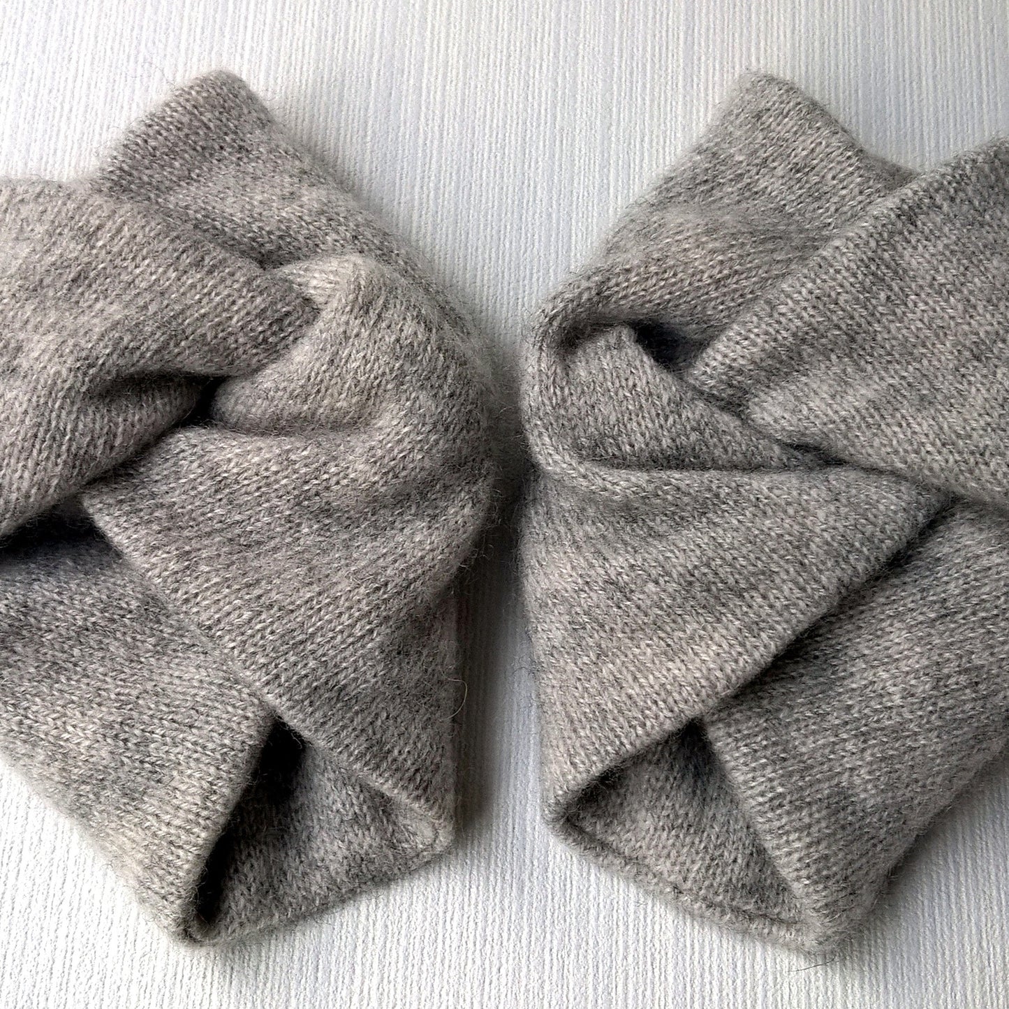 Double thickness handmade pure cashmere wrist warmers in light grey marl.