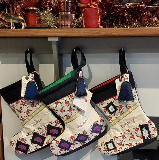Personalised stockings hanging by the fireplace