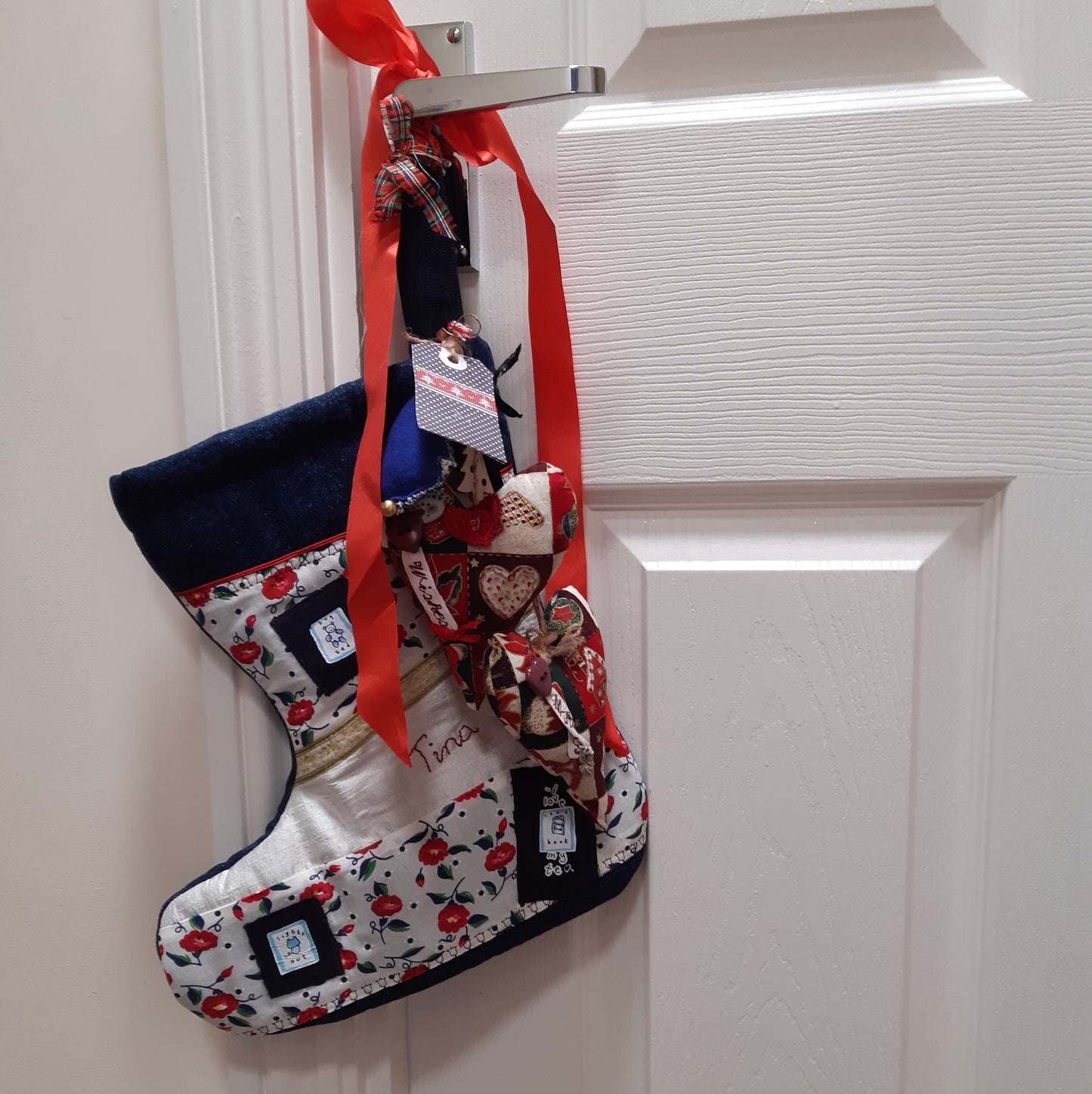 Personalised Christmas stocking hung on a bedroom door