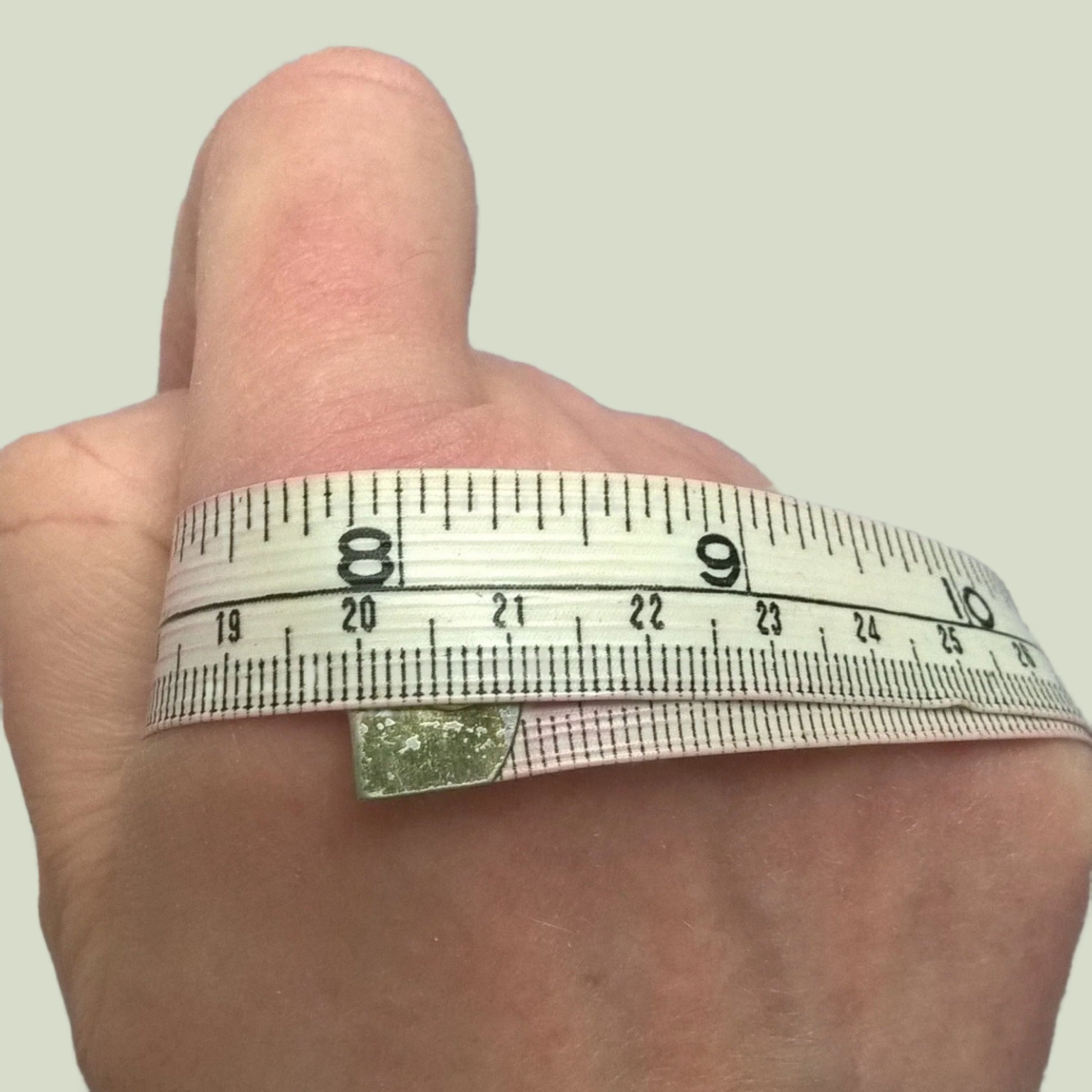 Measure around knuckles for size