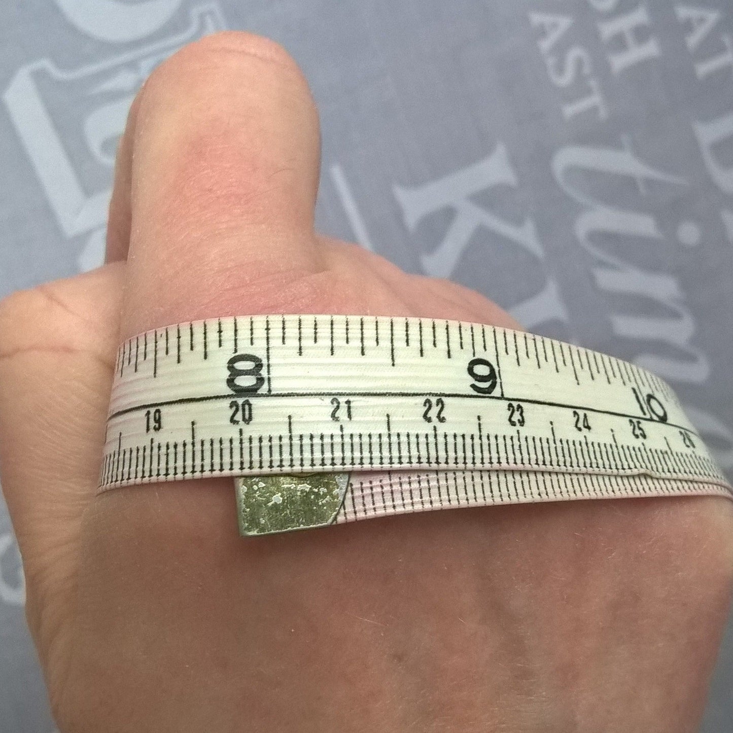 Measure around knuckles for size