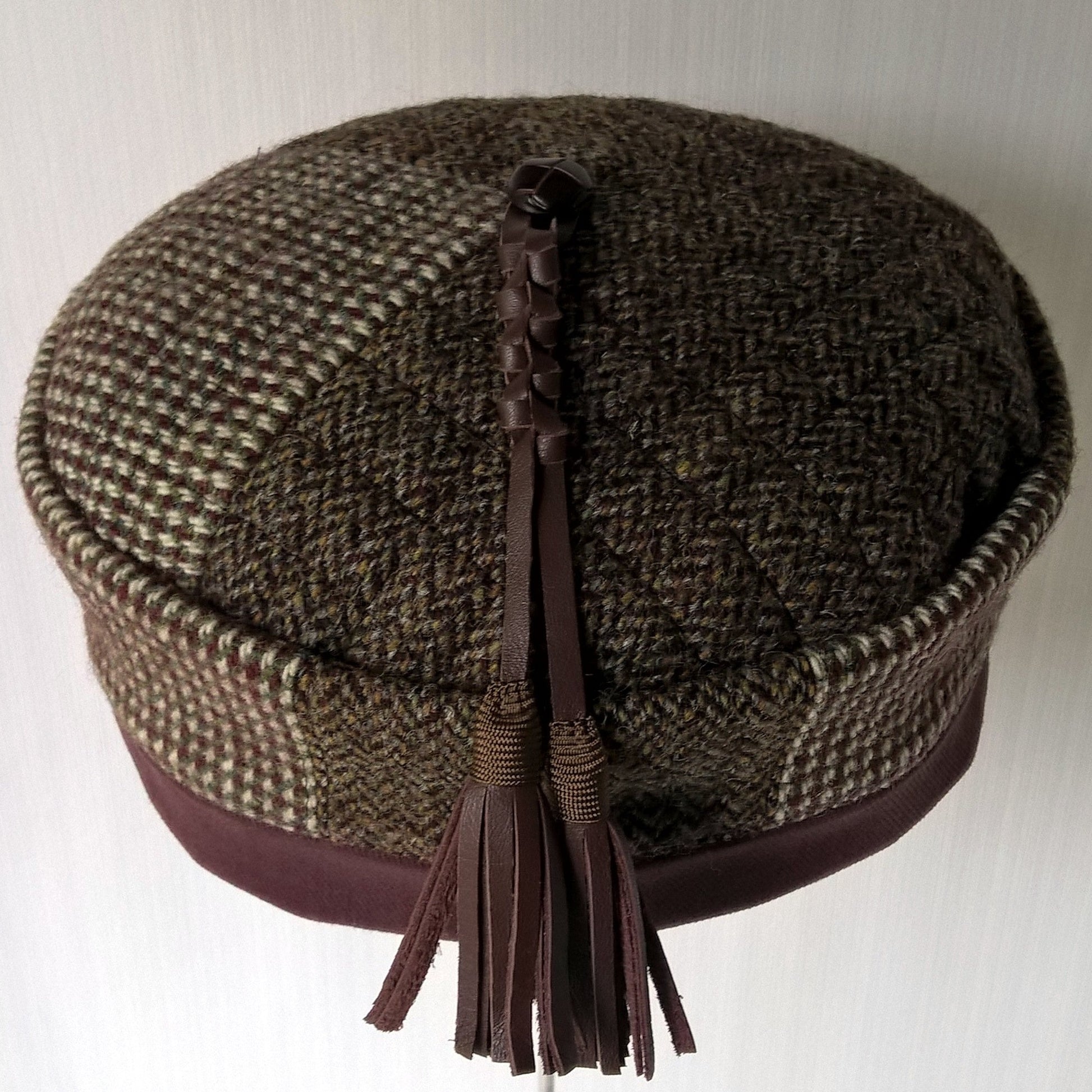 This hat is a patchwork of mismatched tweed 