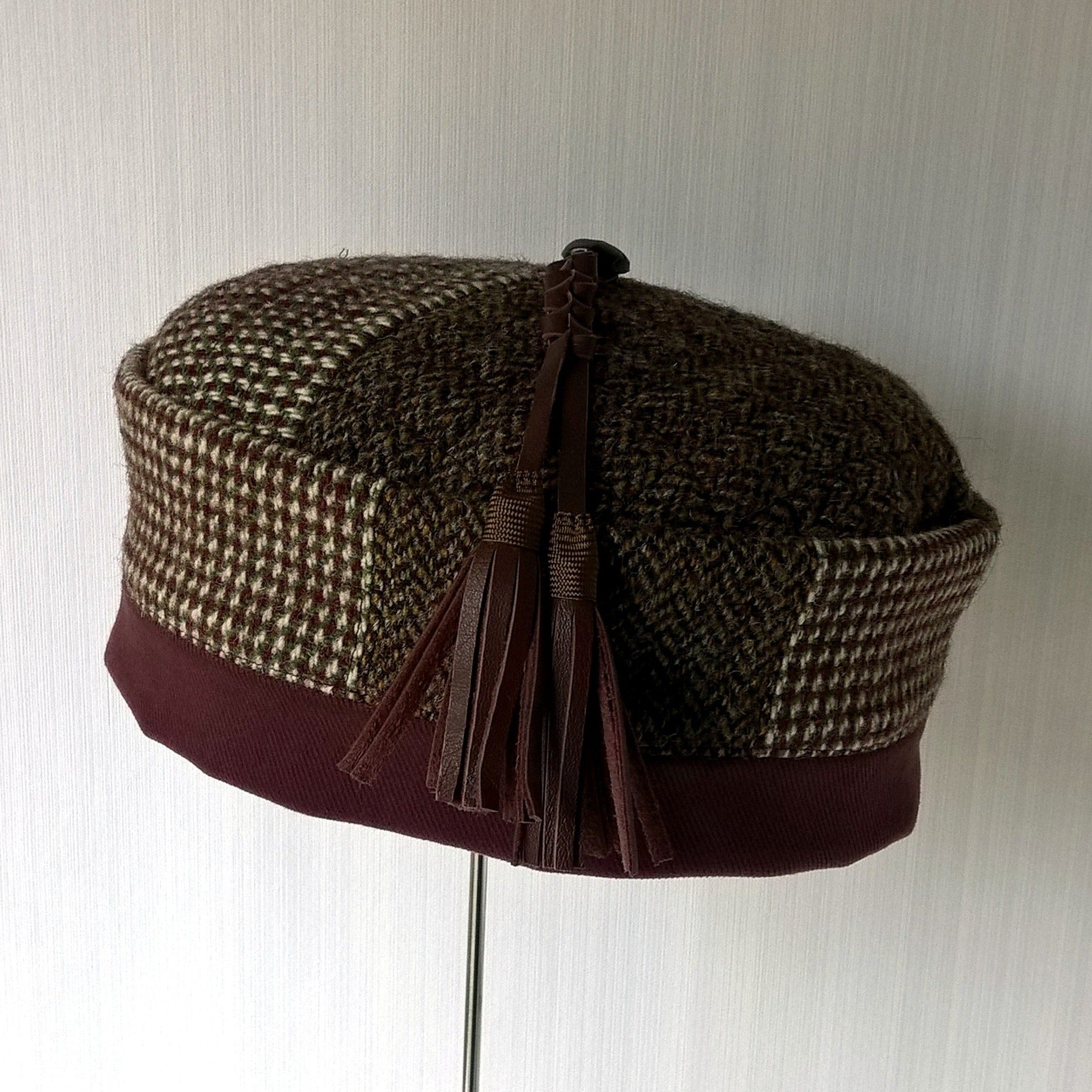 Mismatched tweed smoking cap with leather  macrame tassel