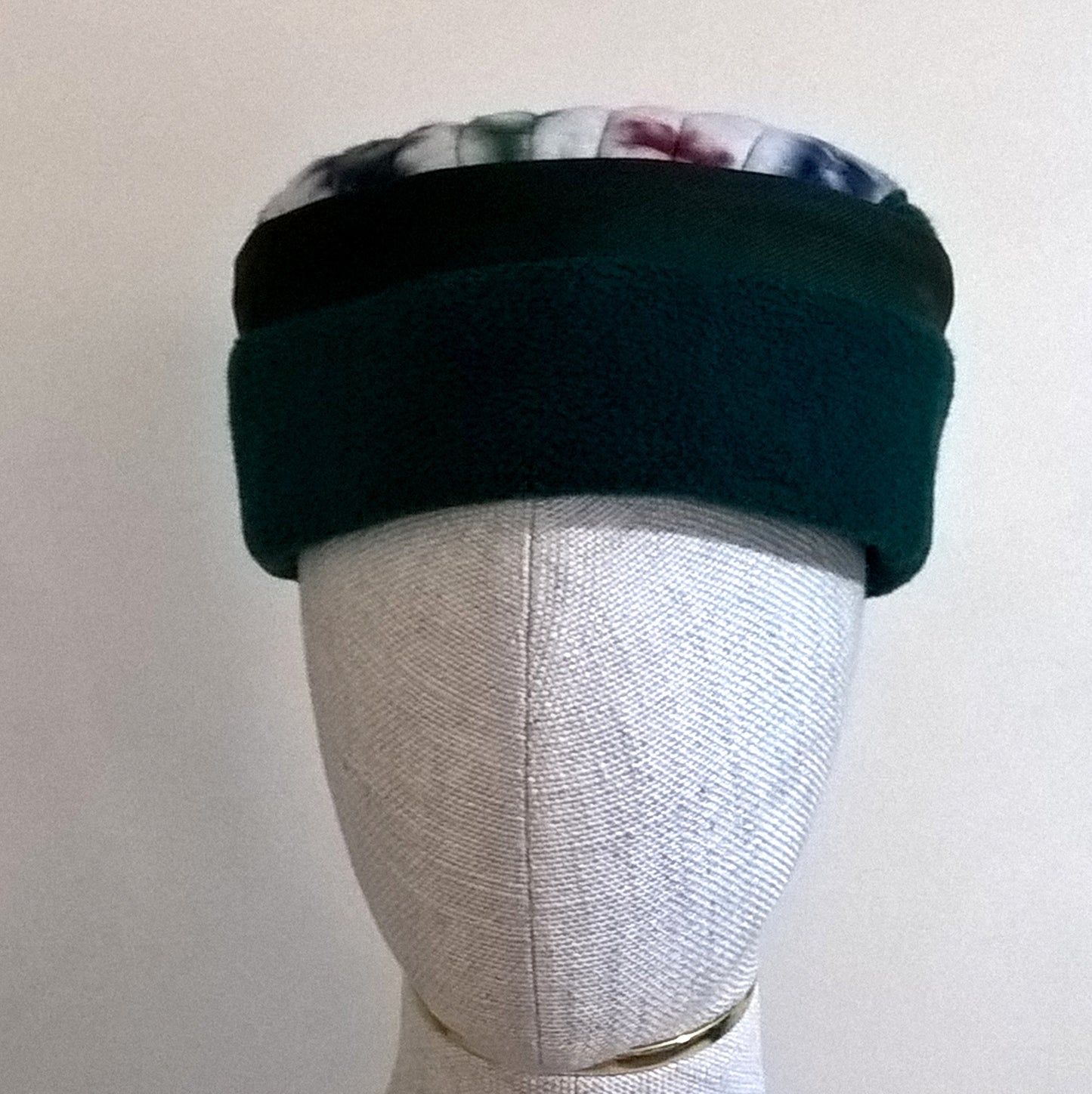 Forest green fleece pillbox hat with patchwork Aztec tip