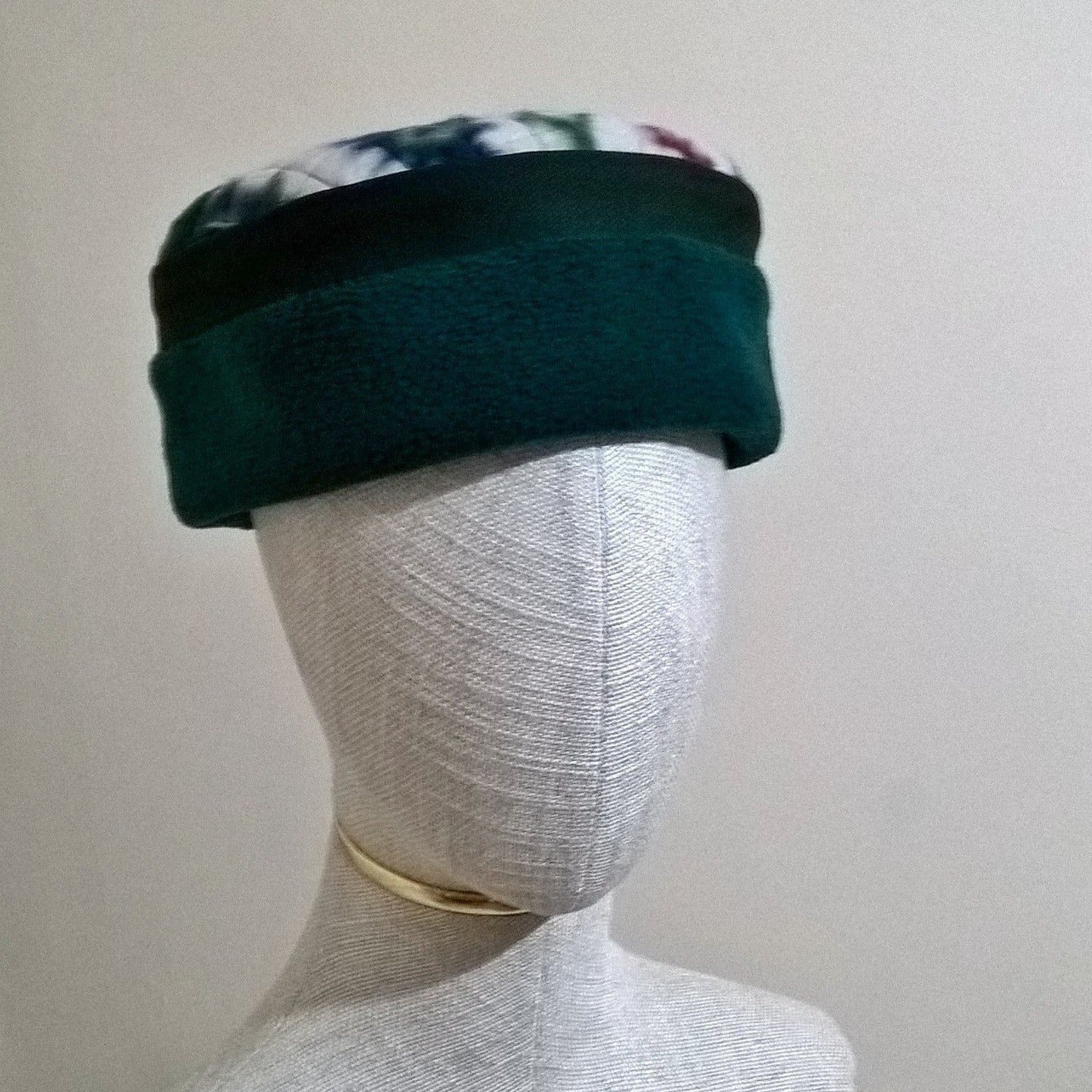 Forest green fleece hat with Aztec patterned tip