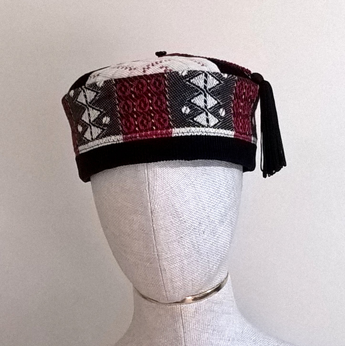 Tassel smoking cap with an Aztec patterned crown handmade in black, cream and red