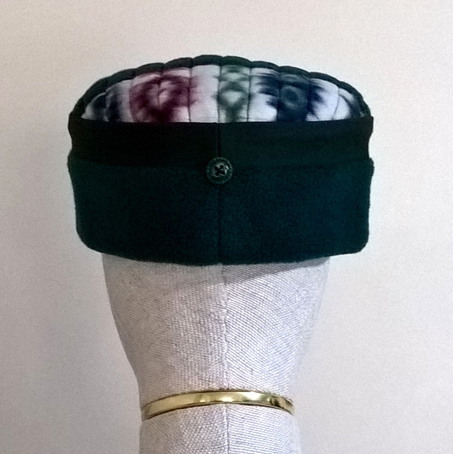 Beck view of green fleece and Aztec patterned skull cap