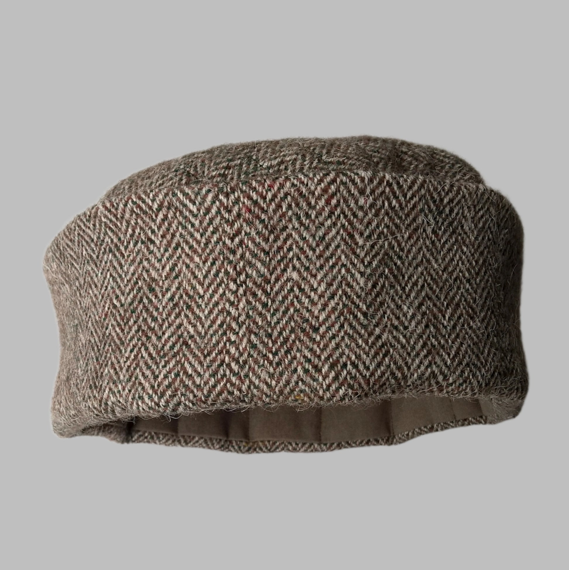 Back view of pillbox Harris Tweed brimless hat with quilted tip and lining