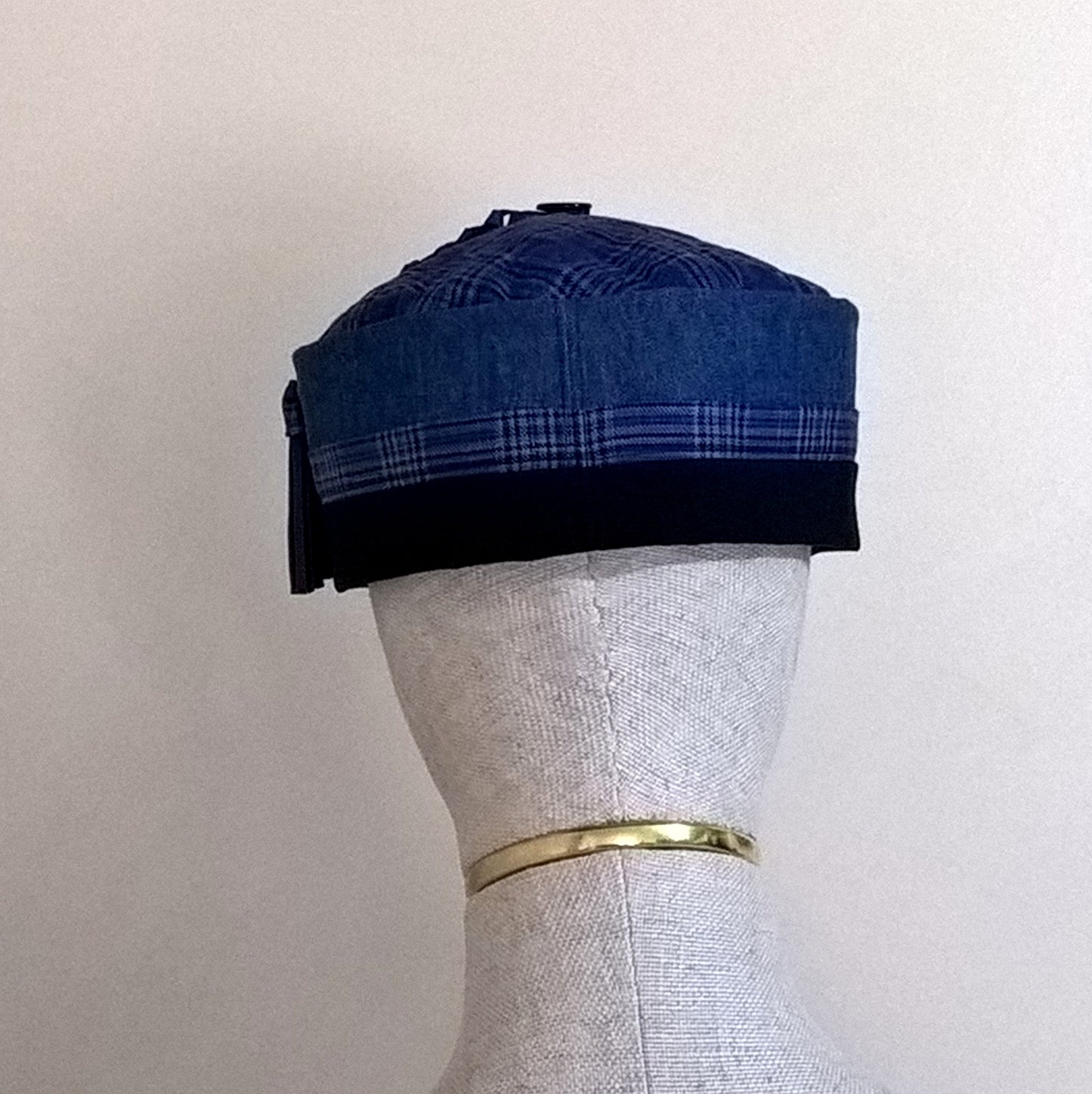 Back view of cobalt blue smoking cap trimmed with fine wool check