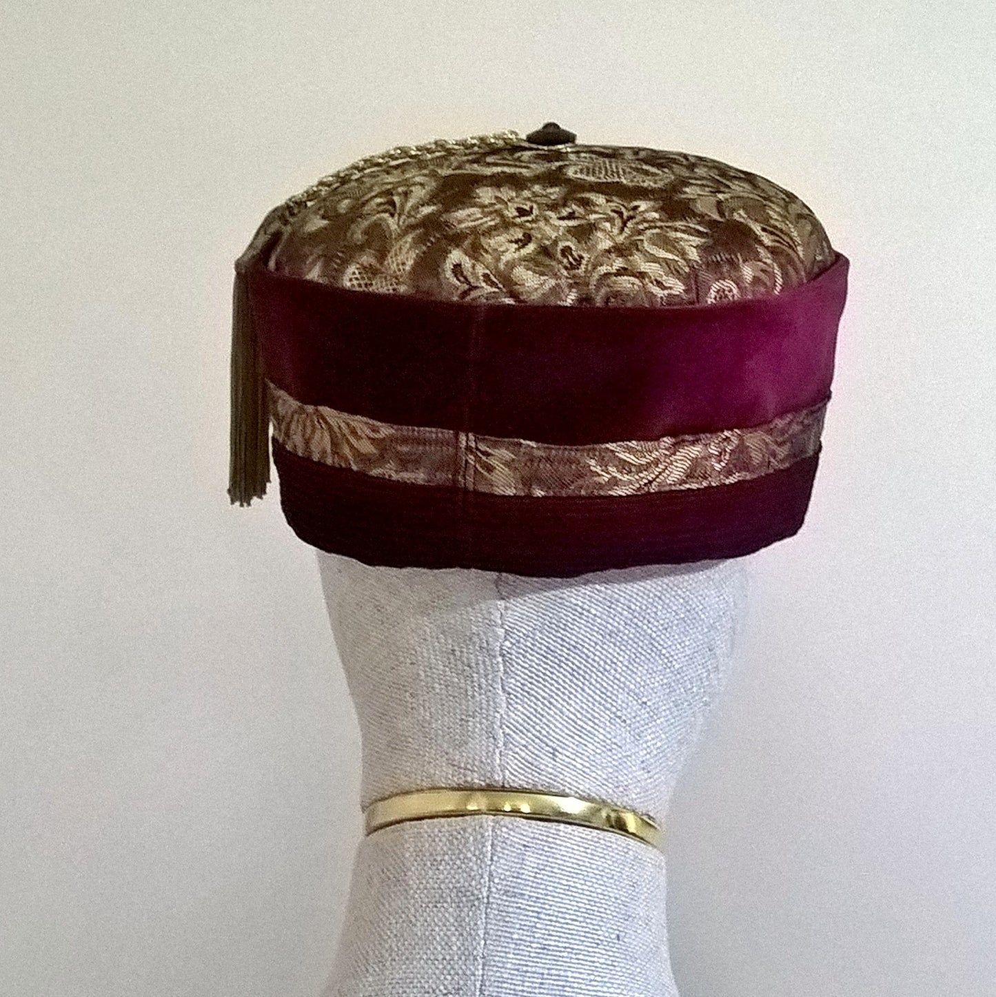 Back view of red velvet and gold brocade smoking cap