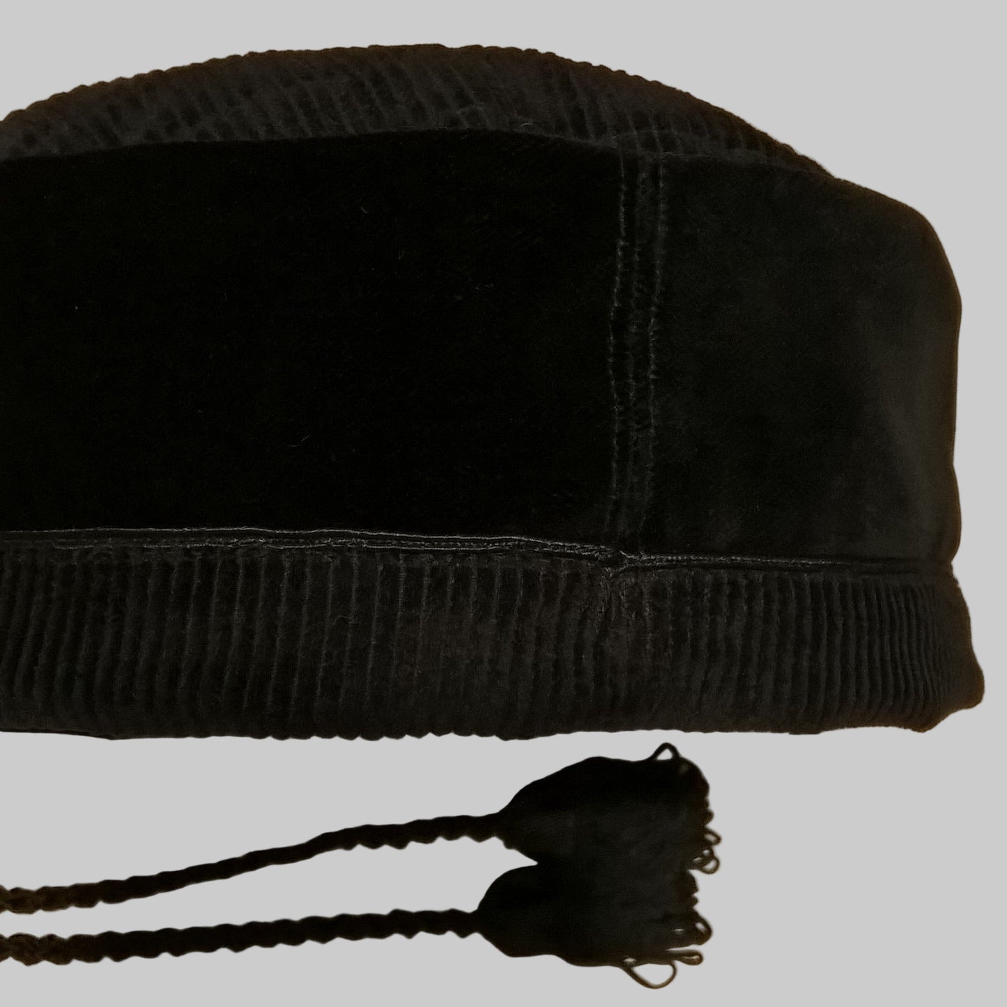 Back view of velvet smoking cap with removable tassel