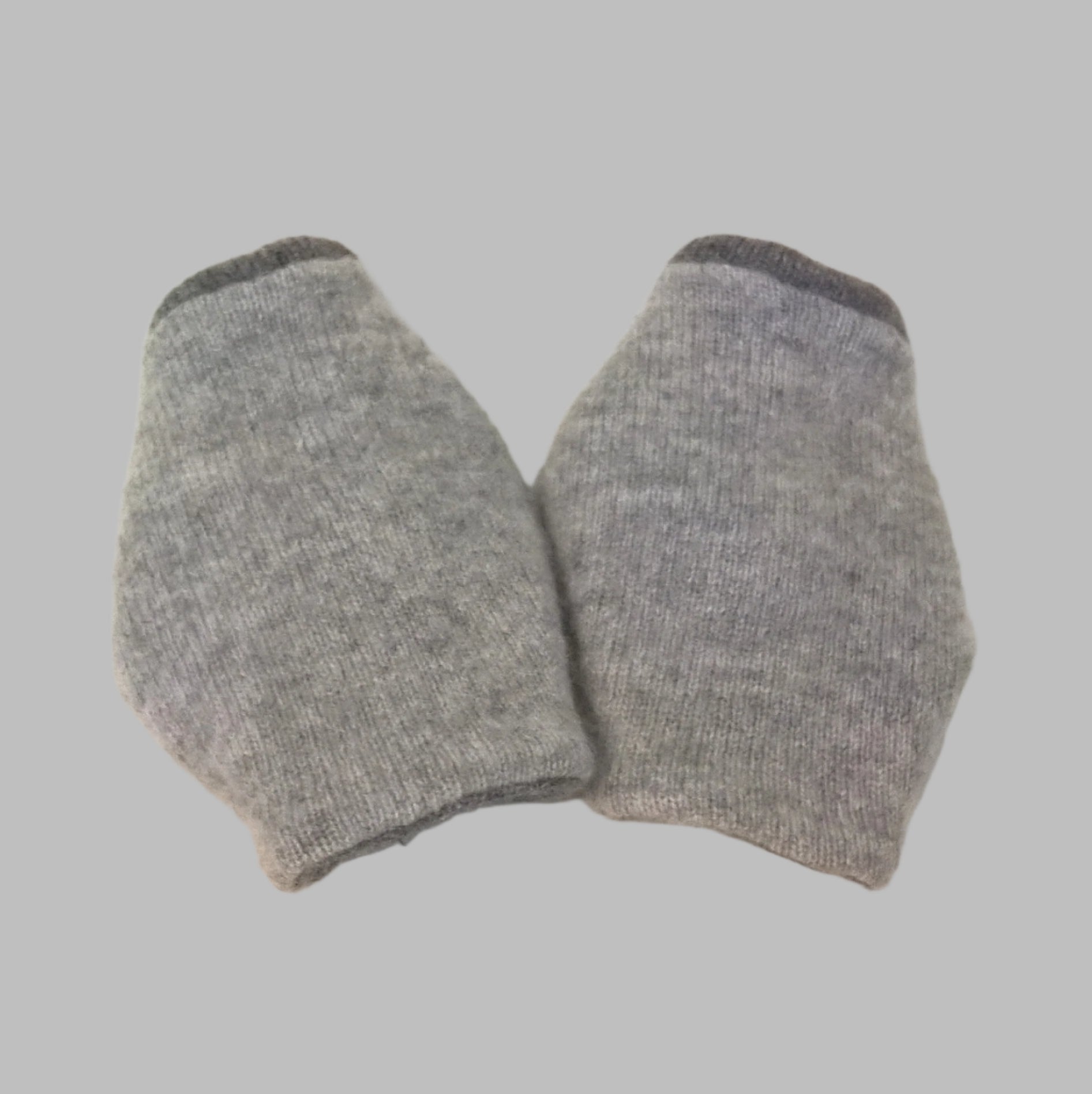 Back view of the two tone grey pure cashmere wrist warmer cuffs, handmade from up-cycled sweaters