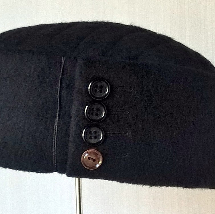 Button detail on crown of up-cycled cashmere hat