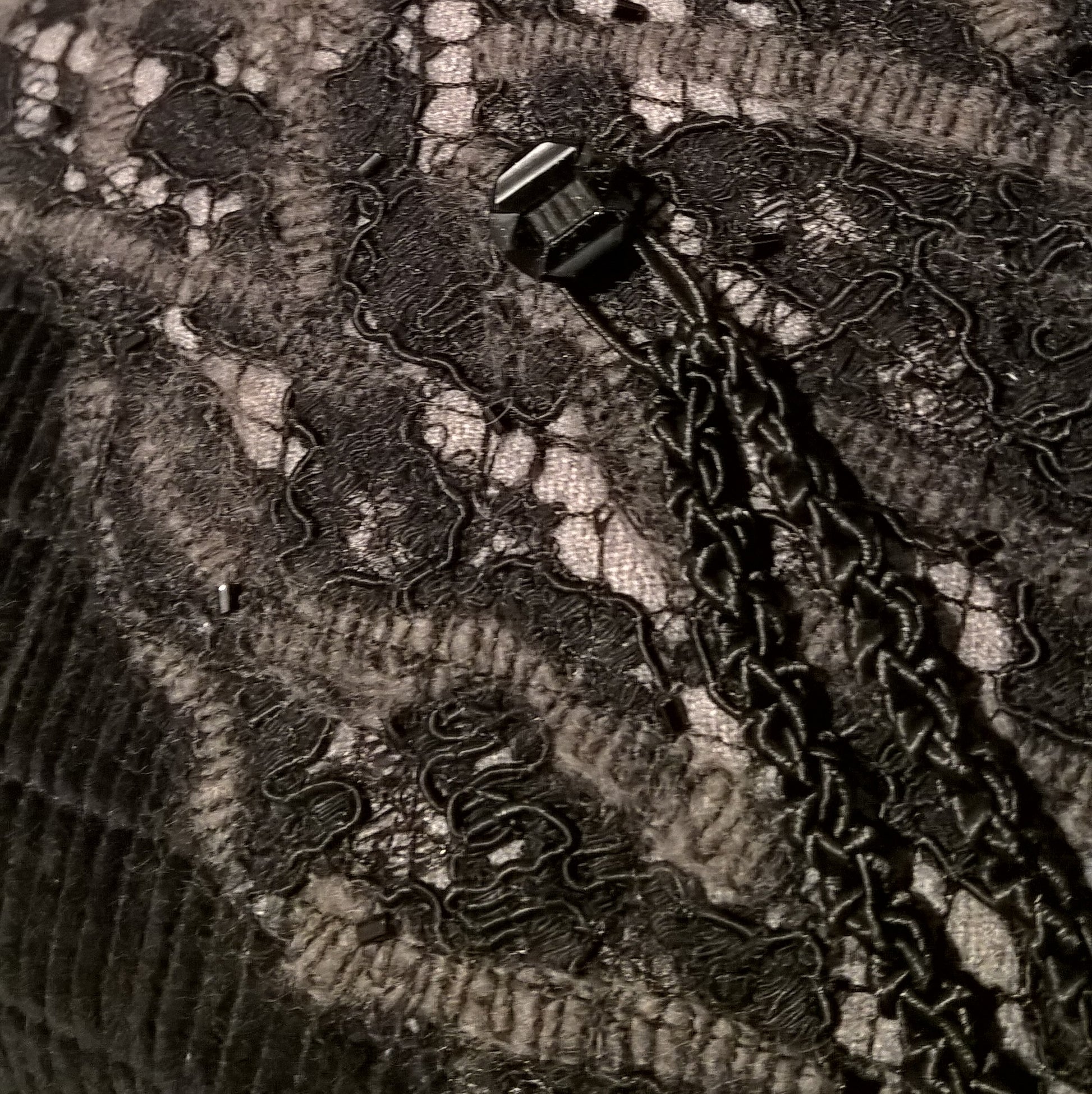 Close-up of the Victorian black glass button with Art Deco detail.