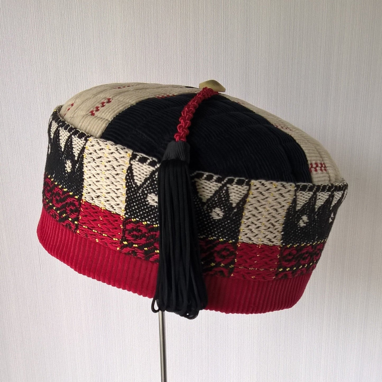 Corduroy smoking cap with vintage ethnic weave fabric in black red and cream