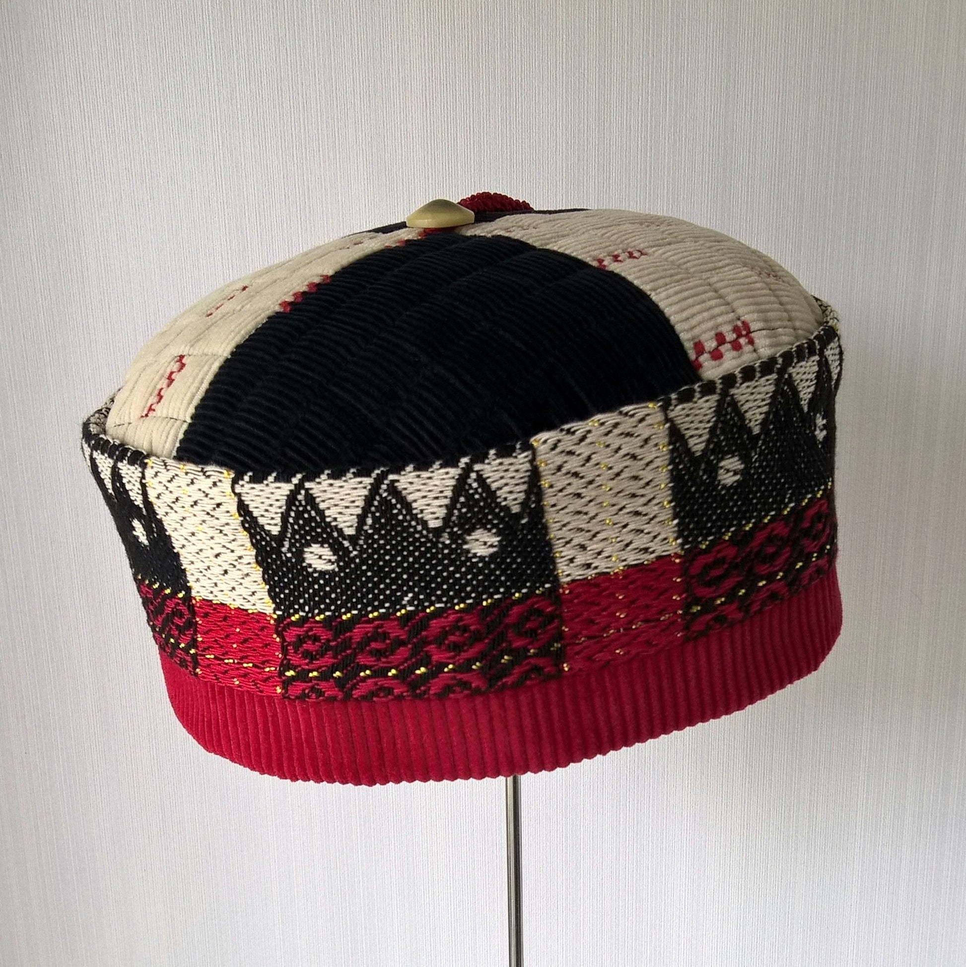 Vintage patterned fabric gives this smoking cap an ethnic feel