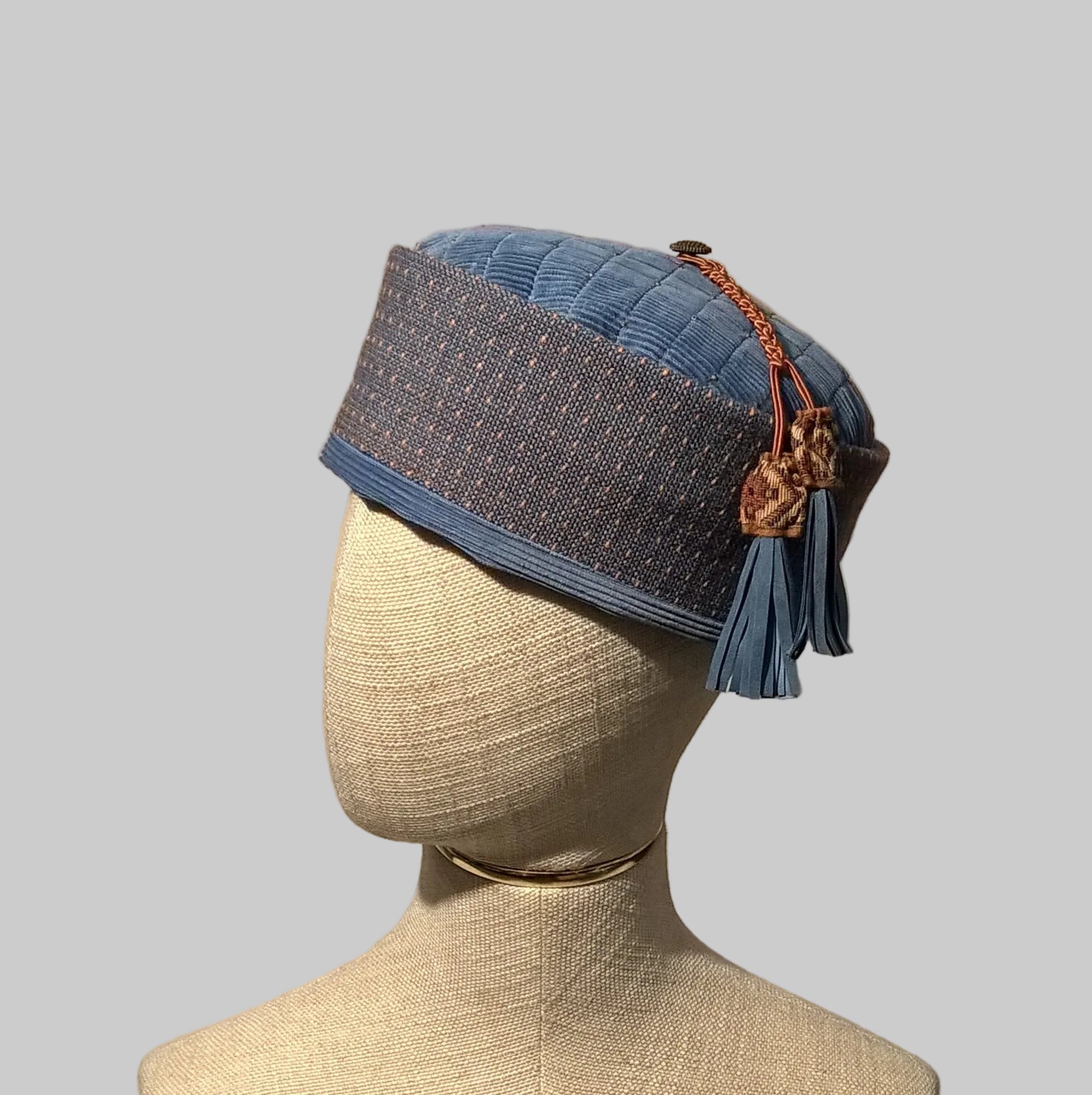 Pale blue corduroy smoking cap with beaded tip and macrame tassel with leather fringing