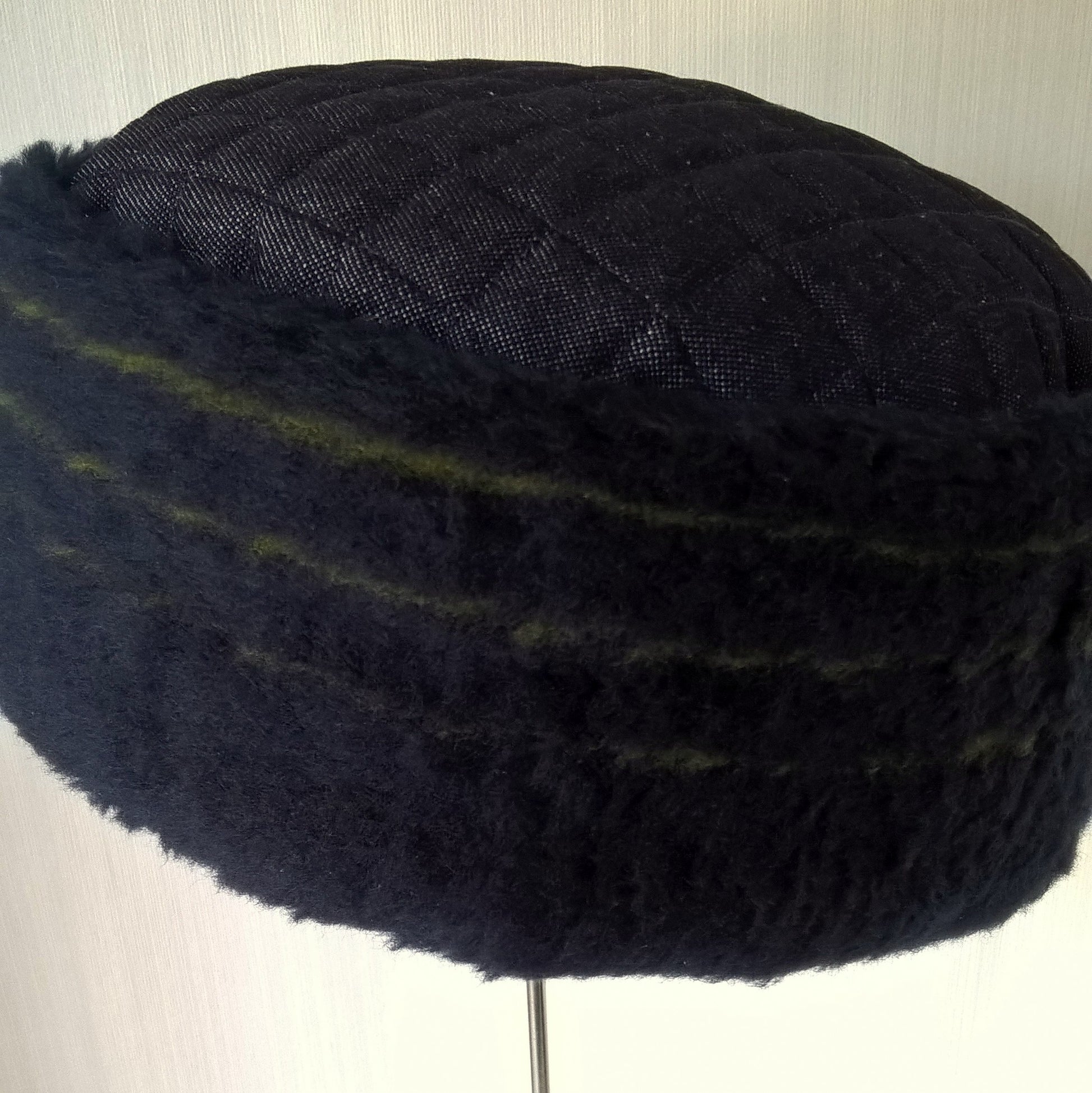 This brimless hat has a plush wool fur crown