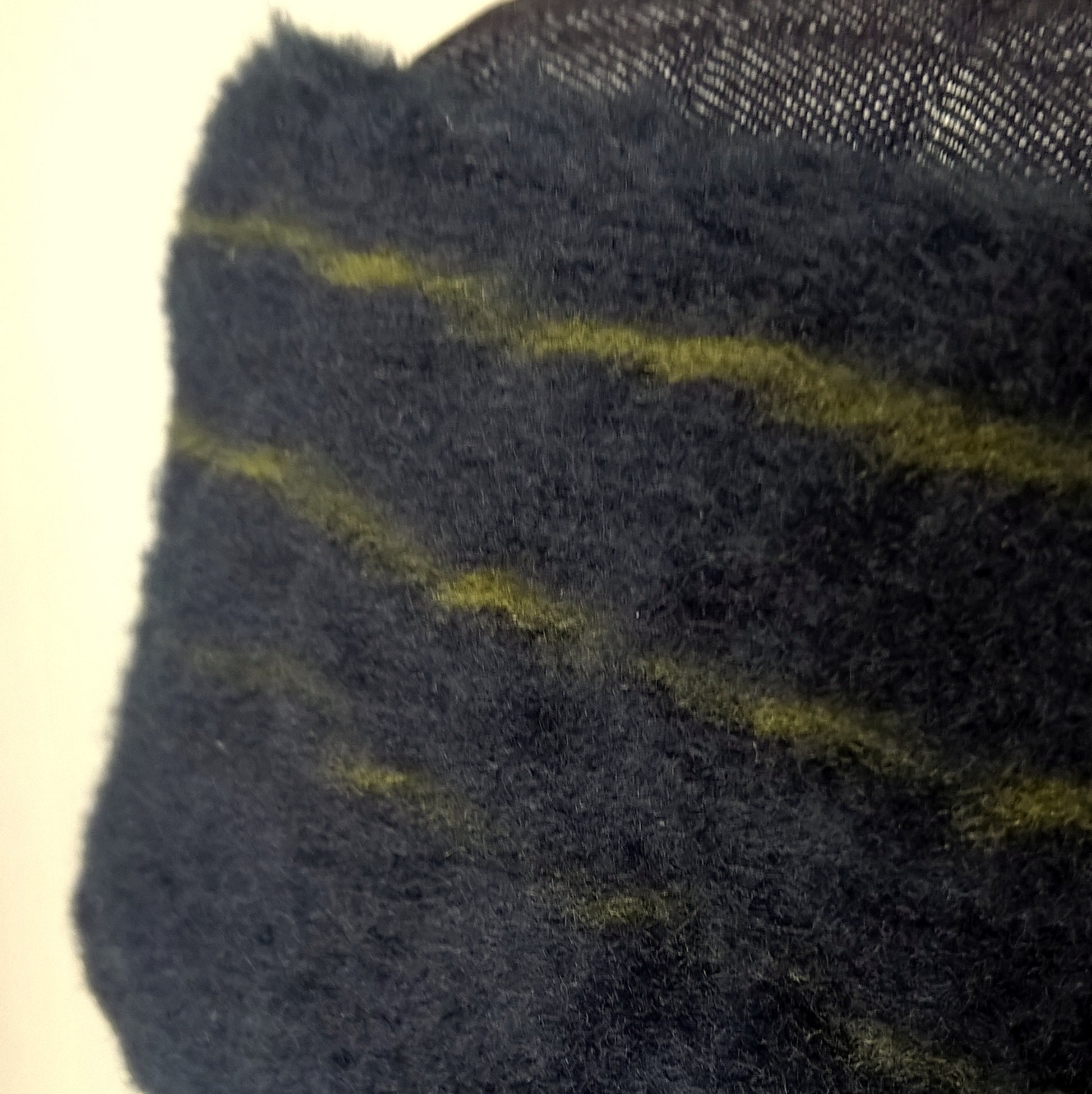 Vintage wool fur in blue with green stripes has been used for the crown of this brimless hat