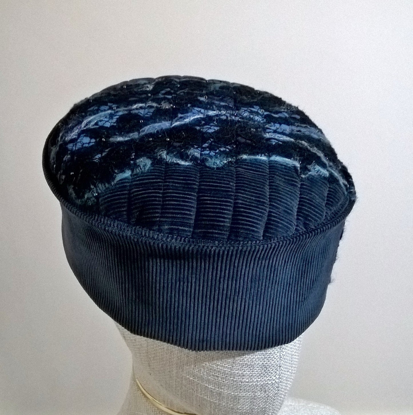 Pillbox style hat with nuno felting embellishment 