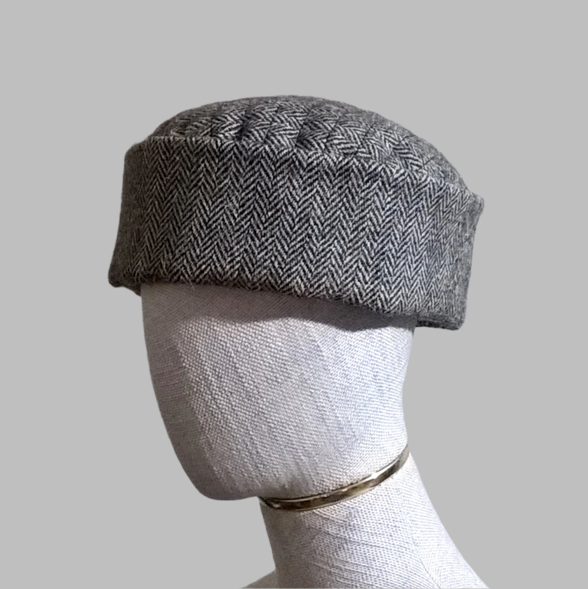 Harris Tweed wool brimless pillbox cap in brown herringbone with quilted cotton lining