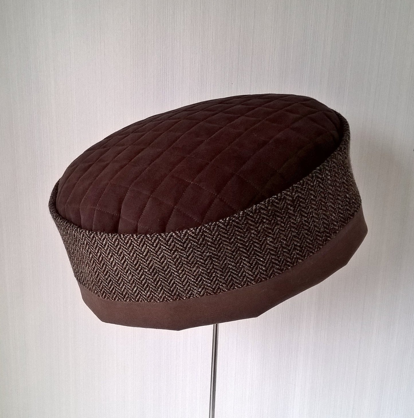 Brimless wool cap in brown tweed herringbone with quilted tip