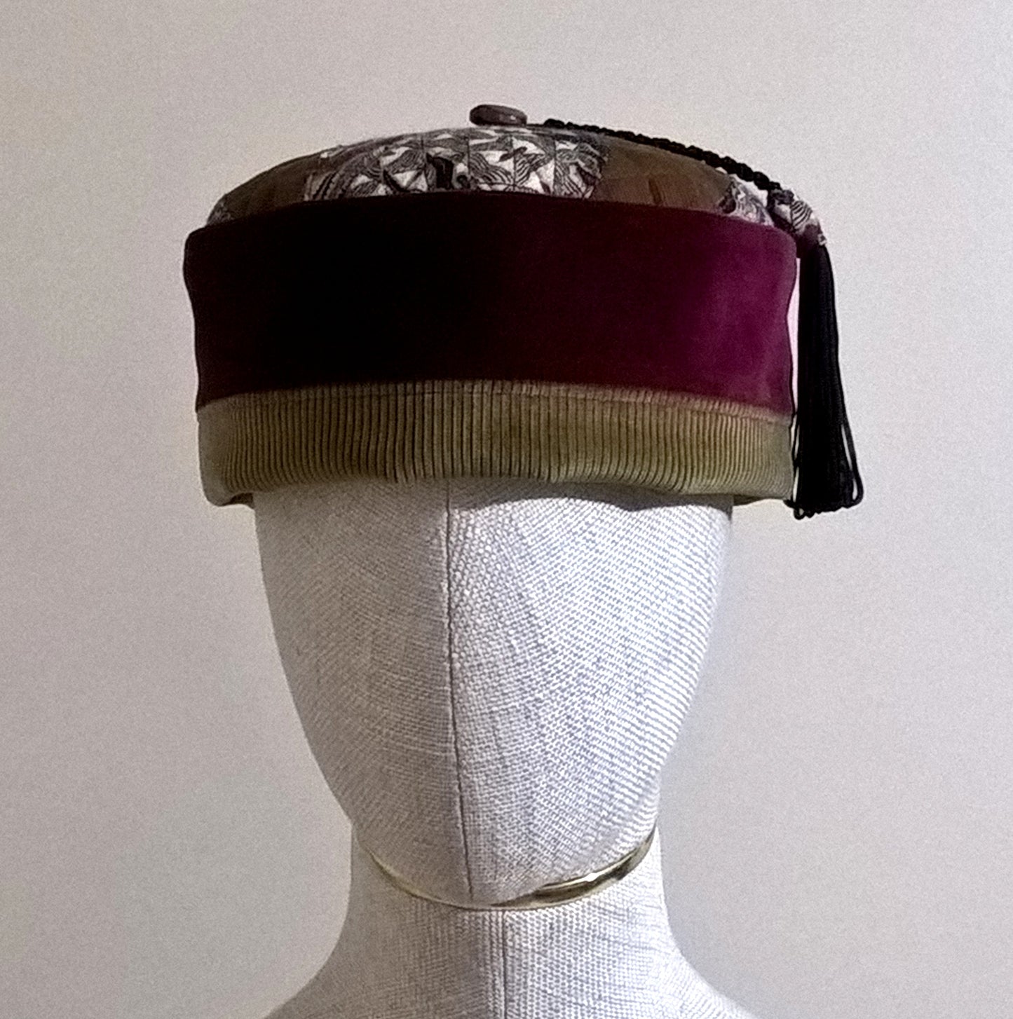 Handmade smoking cap with burgundy  velvet crown edged with brown corduroy and paisley applique tip. Hat has a macrame and paisley tassel