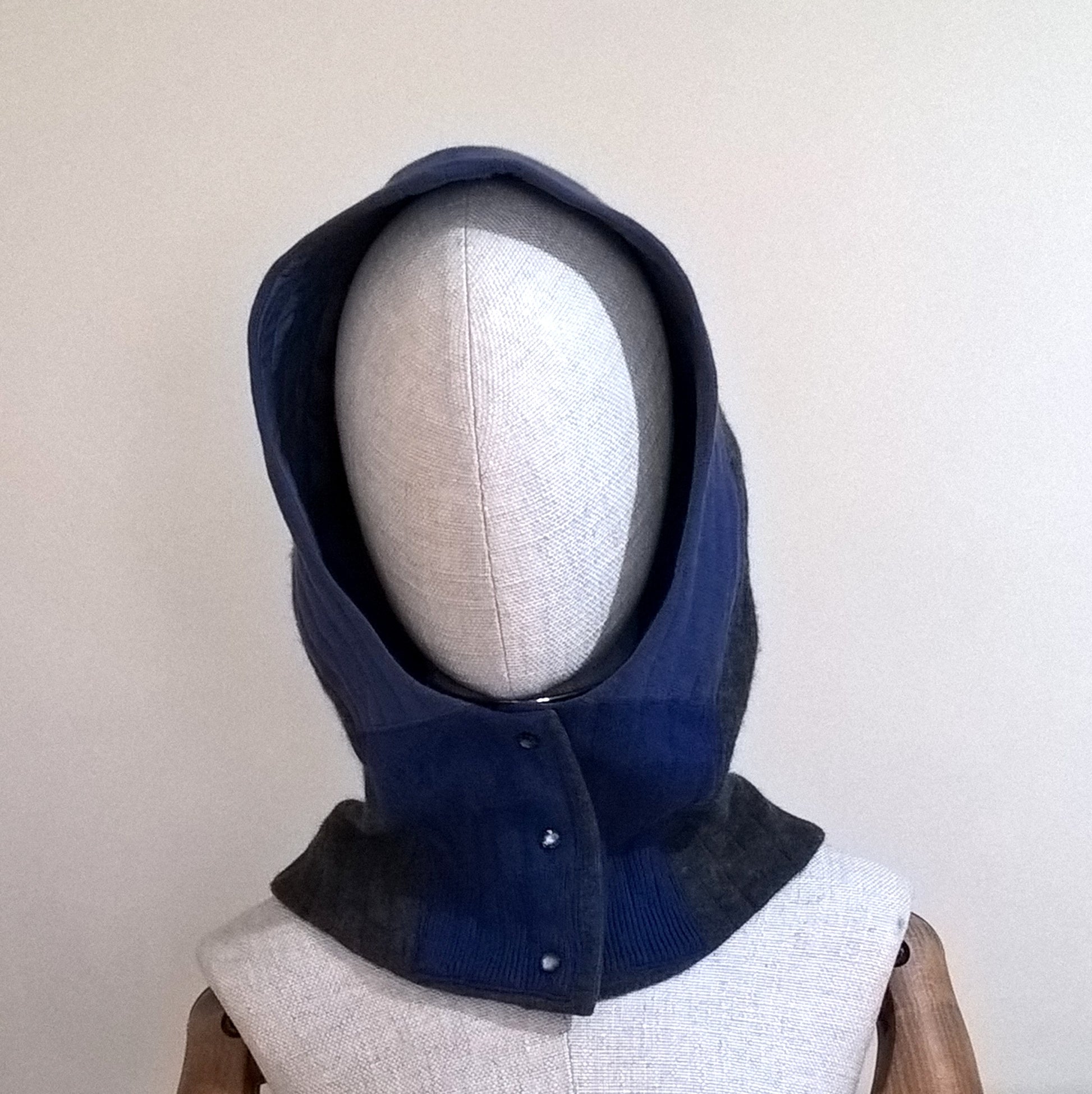 Cashmere quilted hood with front button closure