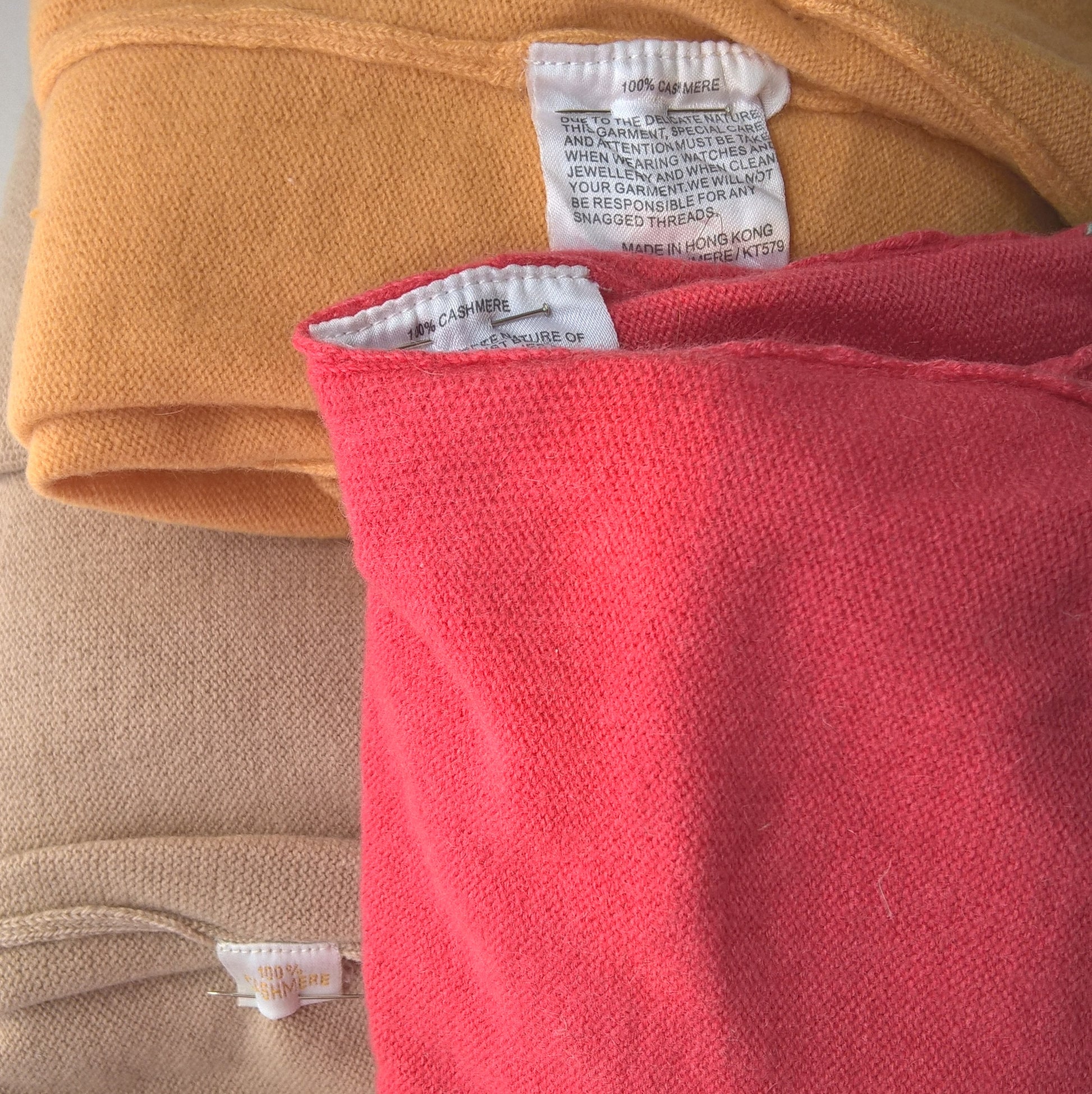 Pure cashmere sweaters in fawn, red and yellow ready for upcycling