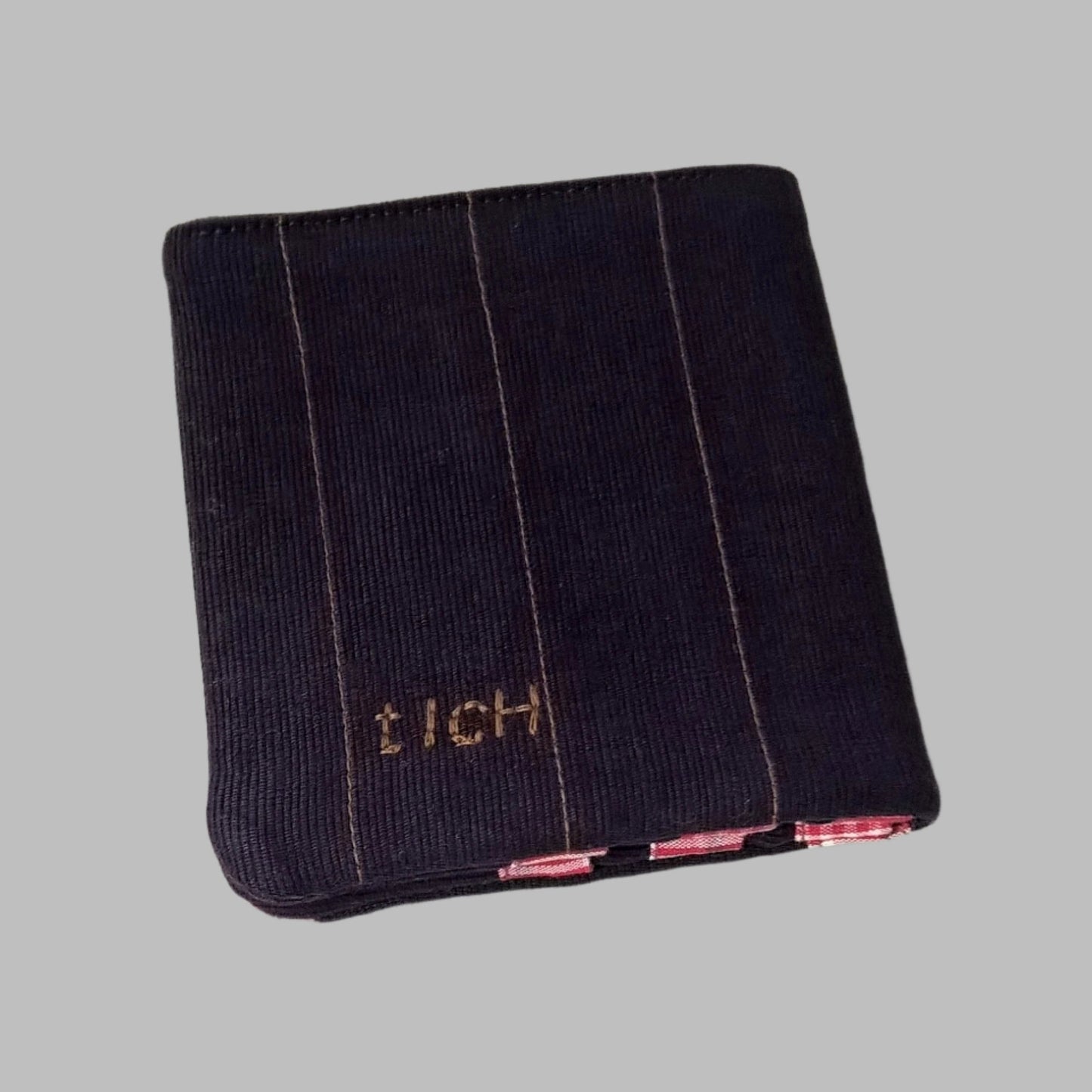 Back view of corduroy wallet with embroidery detail