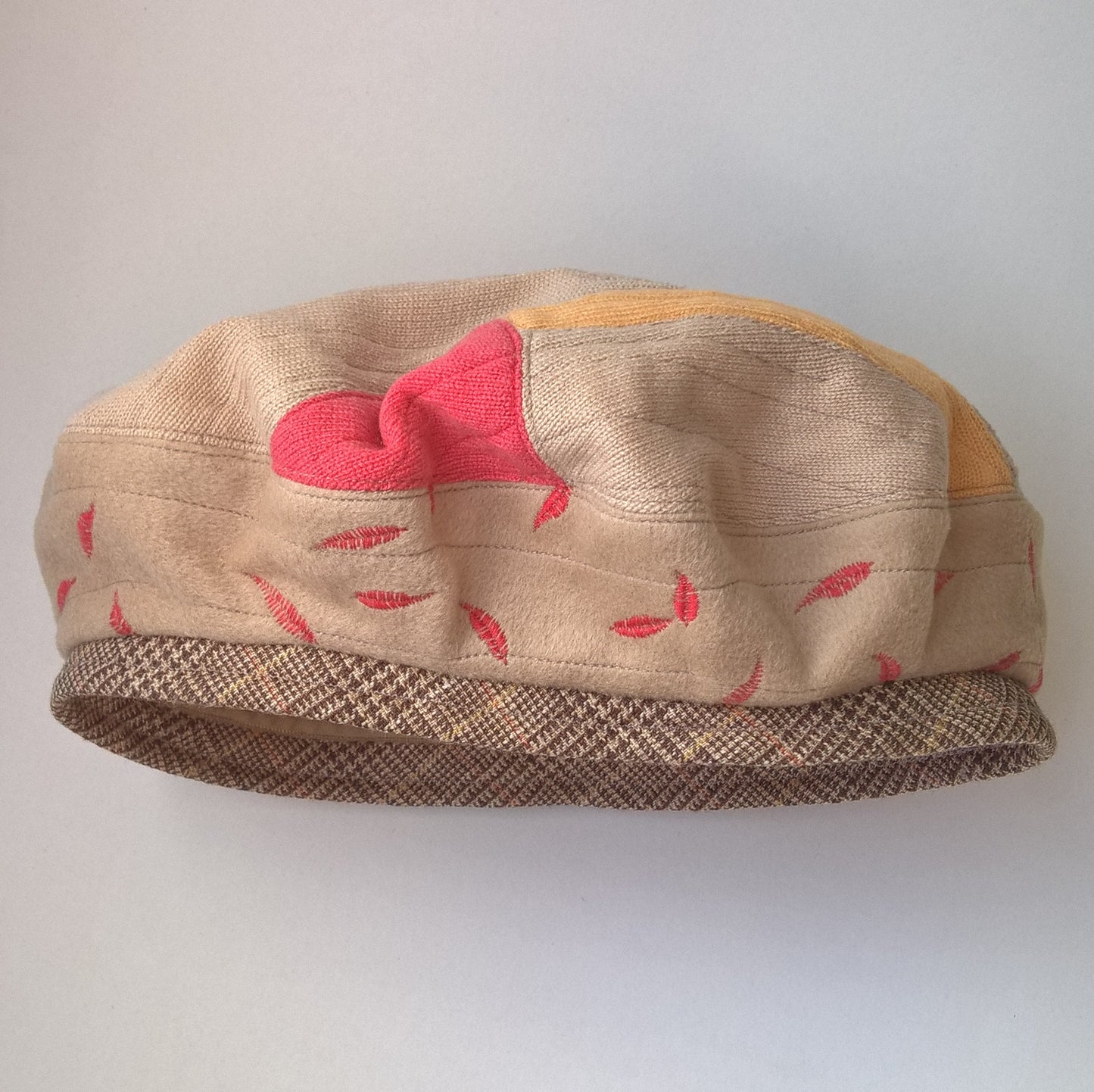 Fawn, red and yellow beret with check wool band and leaf embroidery