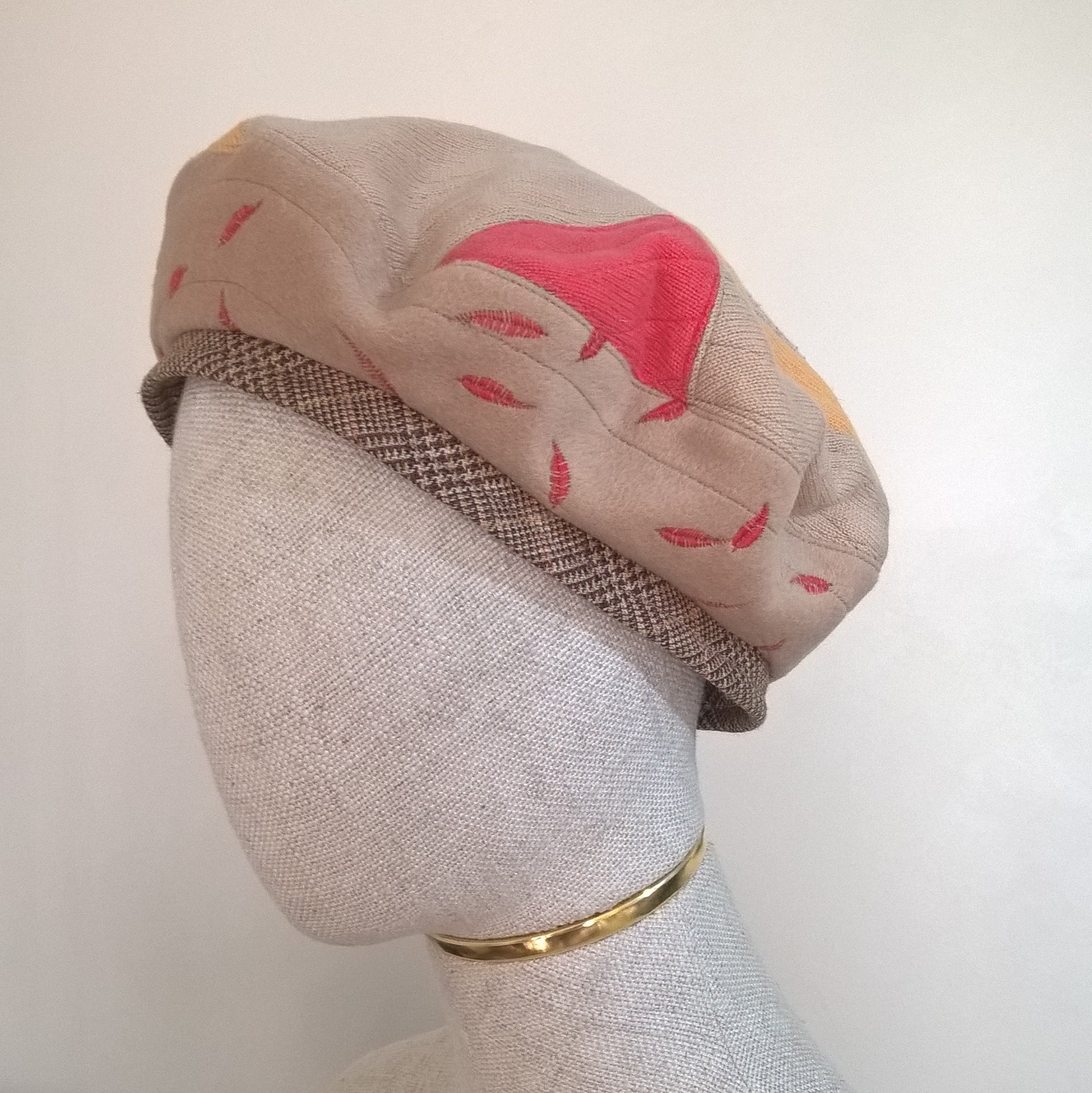 Handmade beret combining upcycled cashmere sweaters and coat.