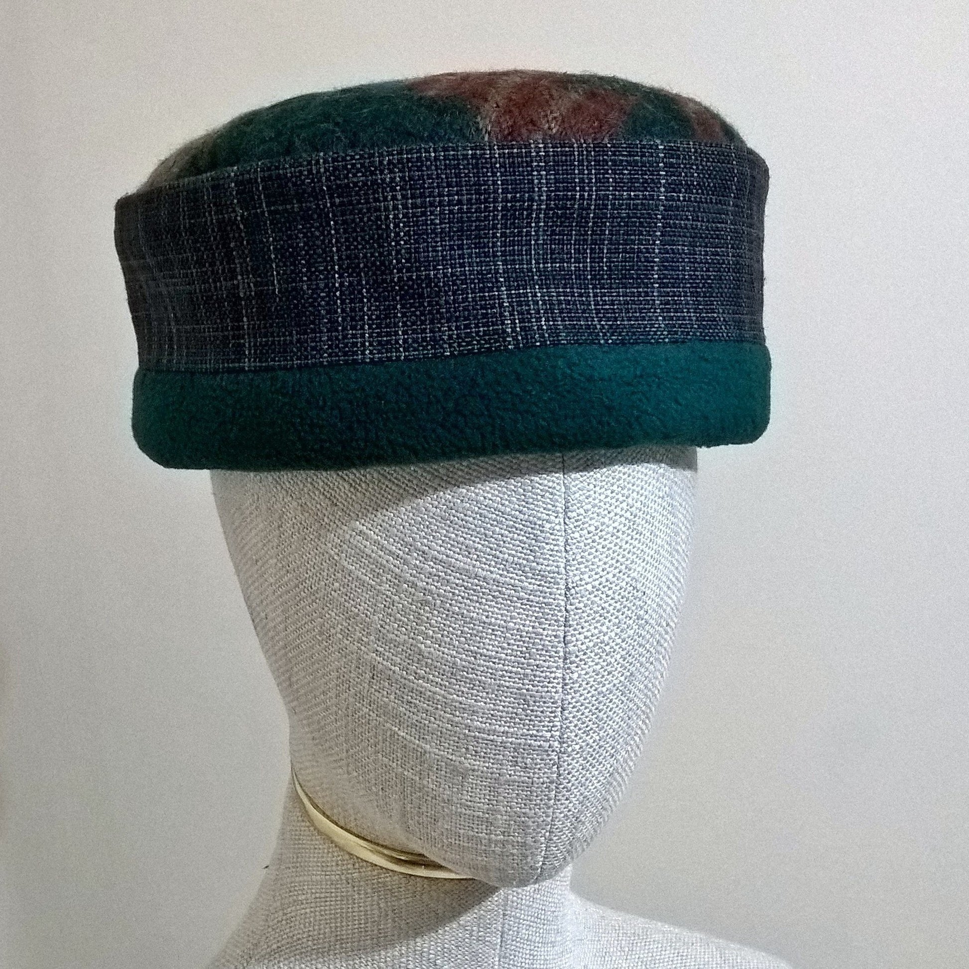 Aztec patterned hat with forest green fleece trim and lining