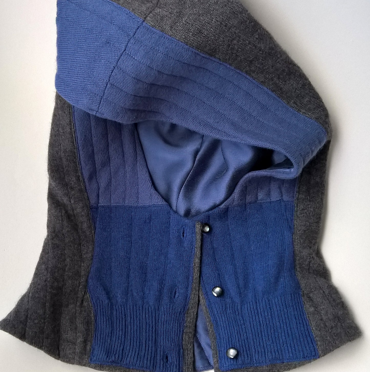 Cashmere patchwork quilted hood with button front fastening