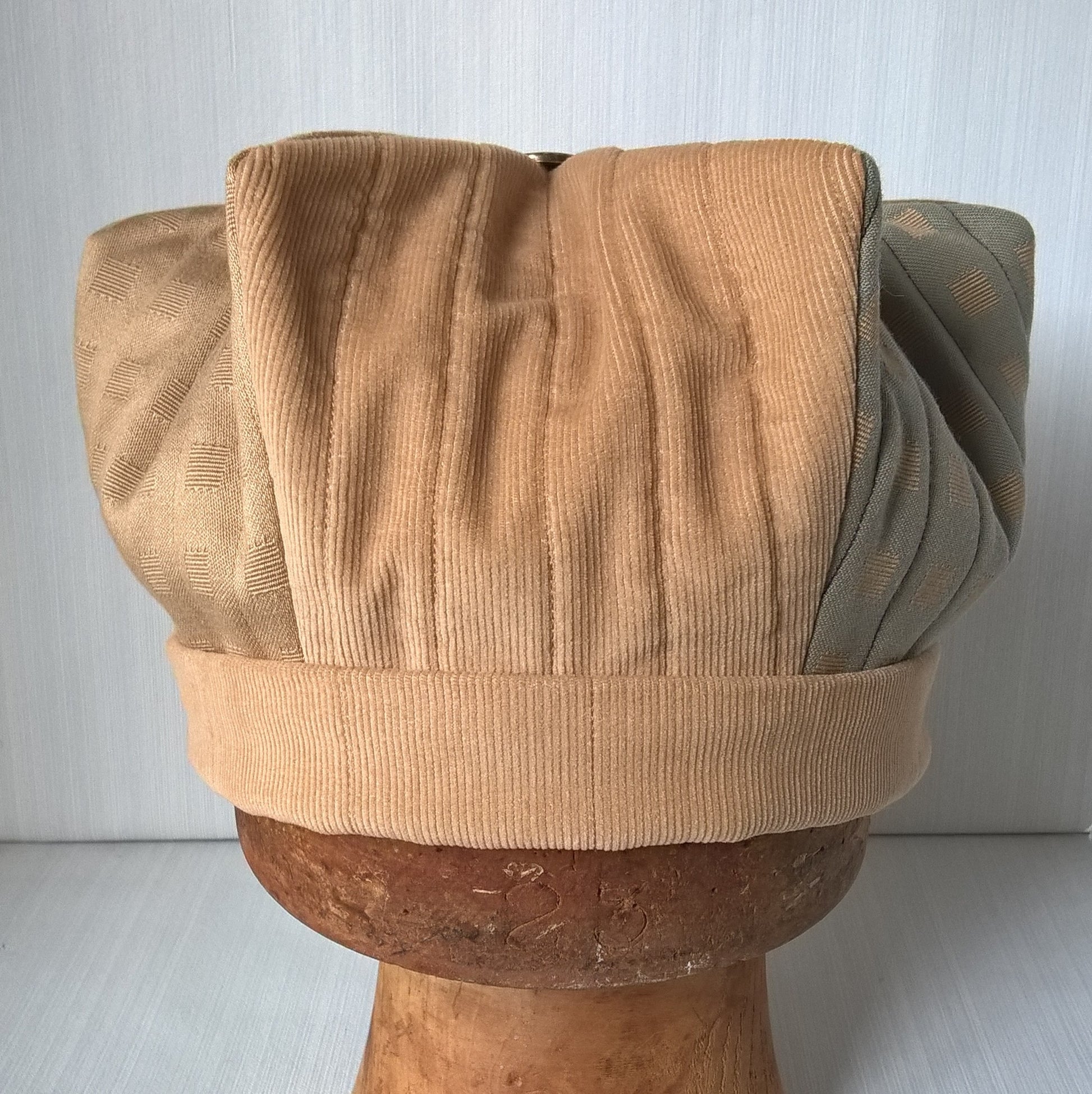The hat is lightly quilted to form the crown shape