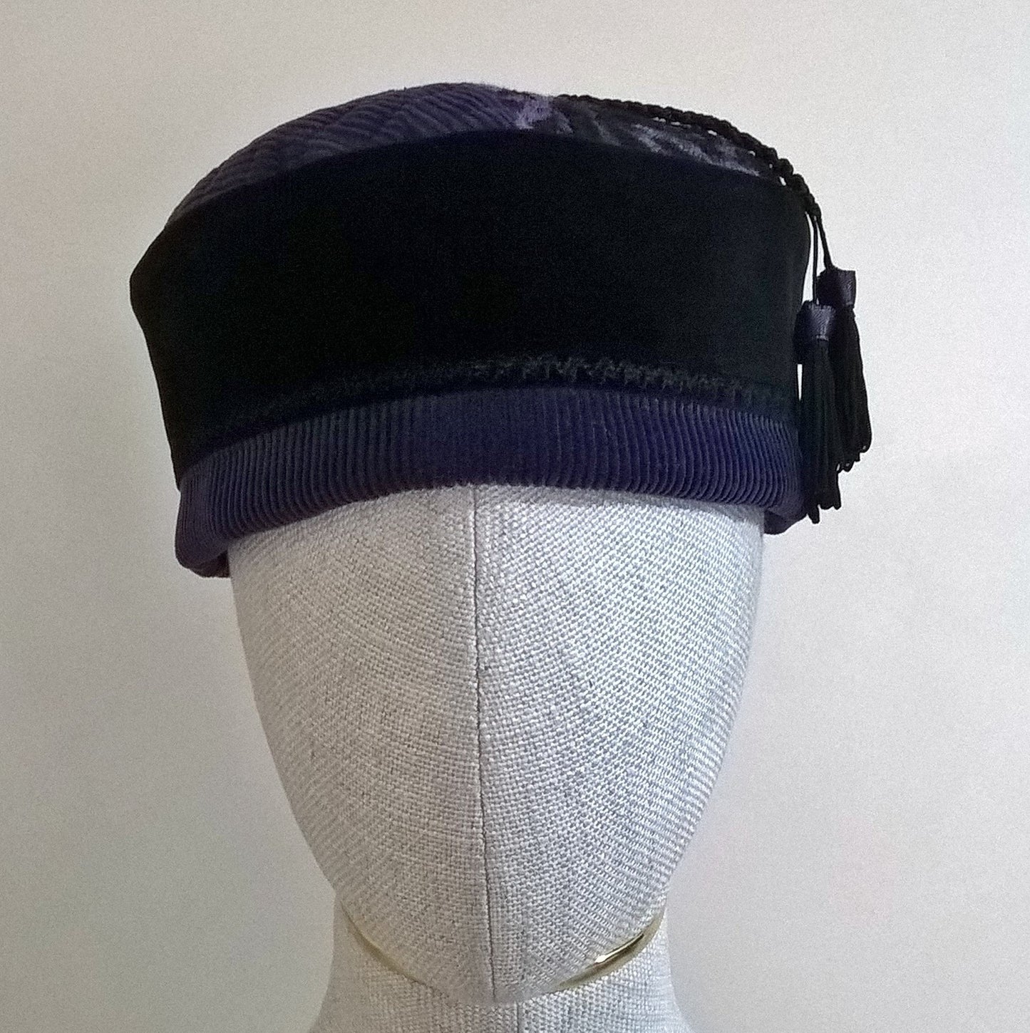 Gothic style pillbox hat handmade in purple corduroy and black velvet, with removable macrame tassel