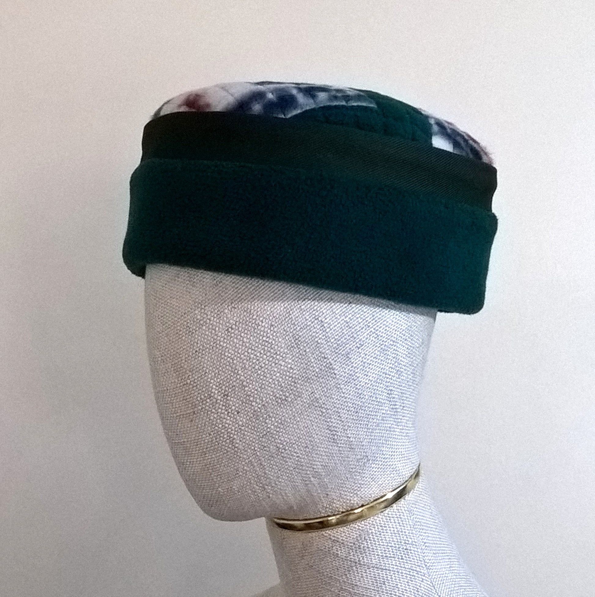 Green fleece hat with Aztec patterned tip