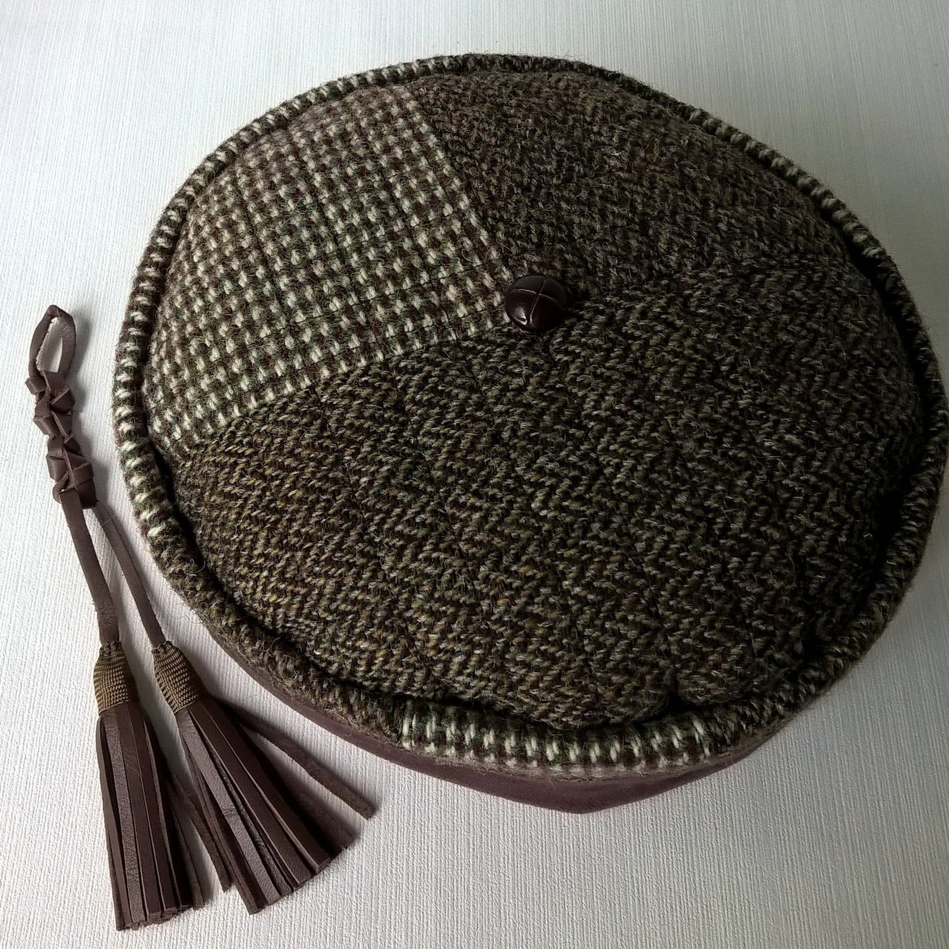 Mismatched Harris Tweed cap with removable leather tassel 