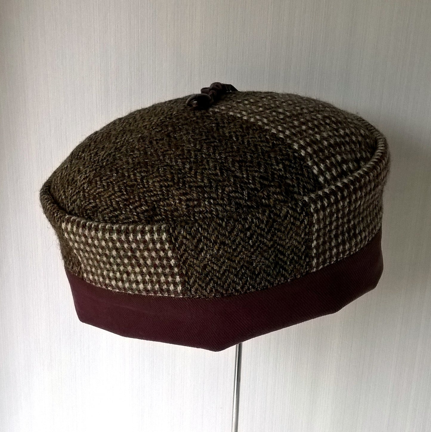 Wool smoking cap in mismatched tweed with removable leather tassel