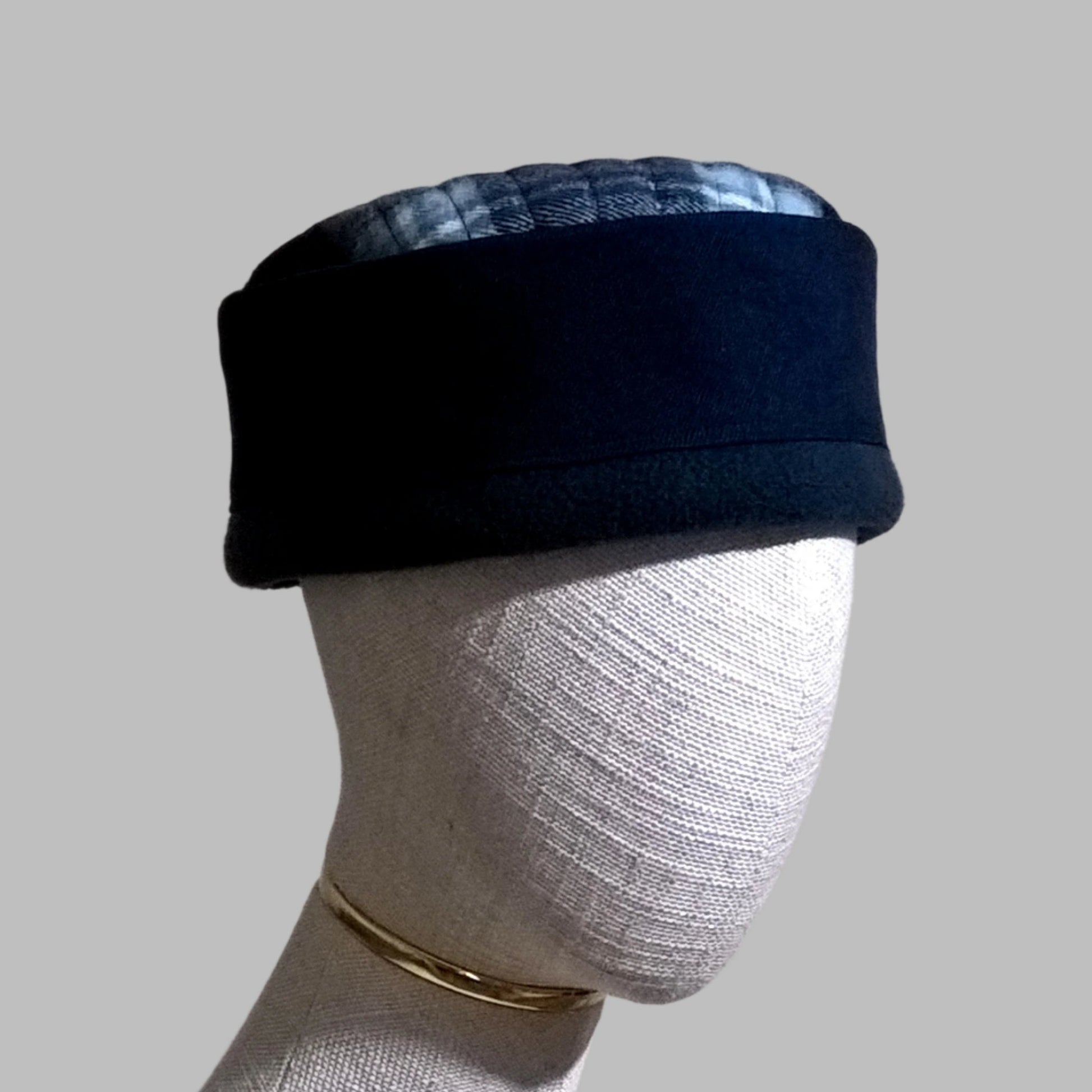 Brimless fleece hat with indigo blue denim crown and lumberjack check tip