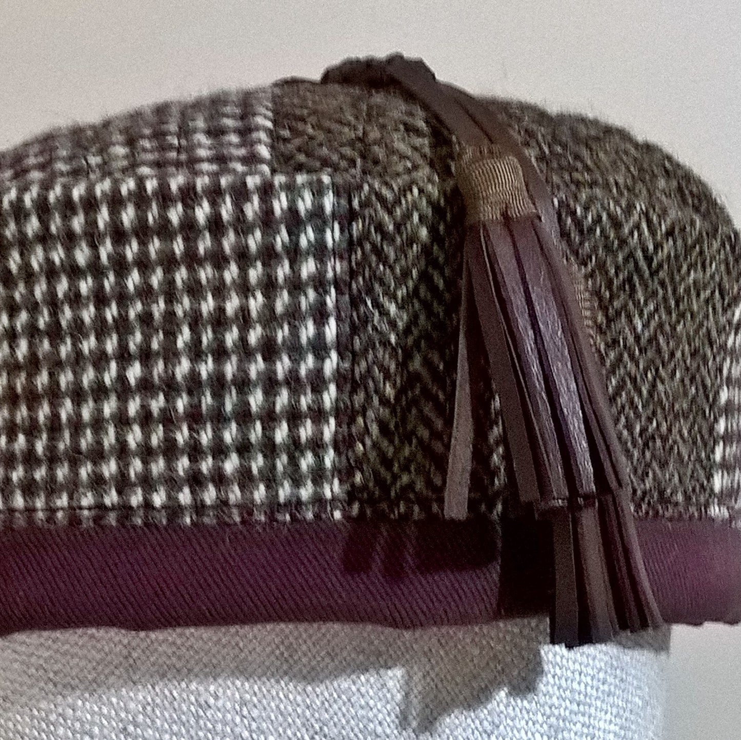 Harris tweed smoking cap in brown, cream, green and burgundy tones edged with maroon