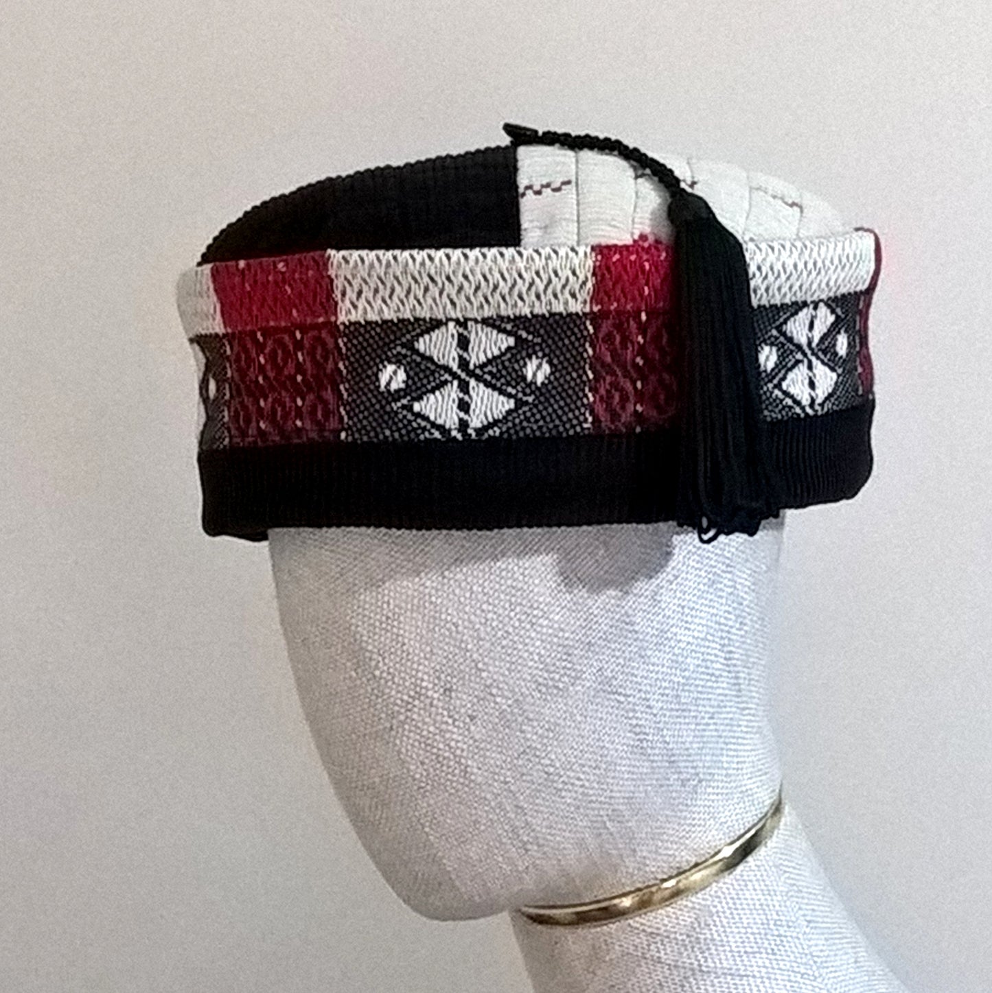 Black, red and cream ethnic smoking cap with macrame tassel